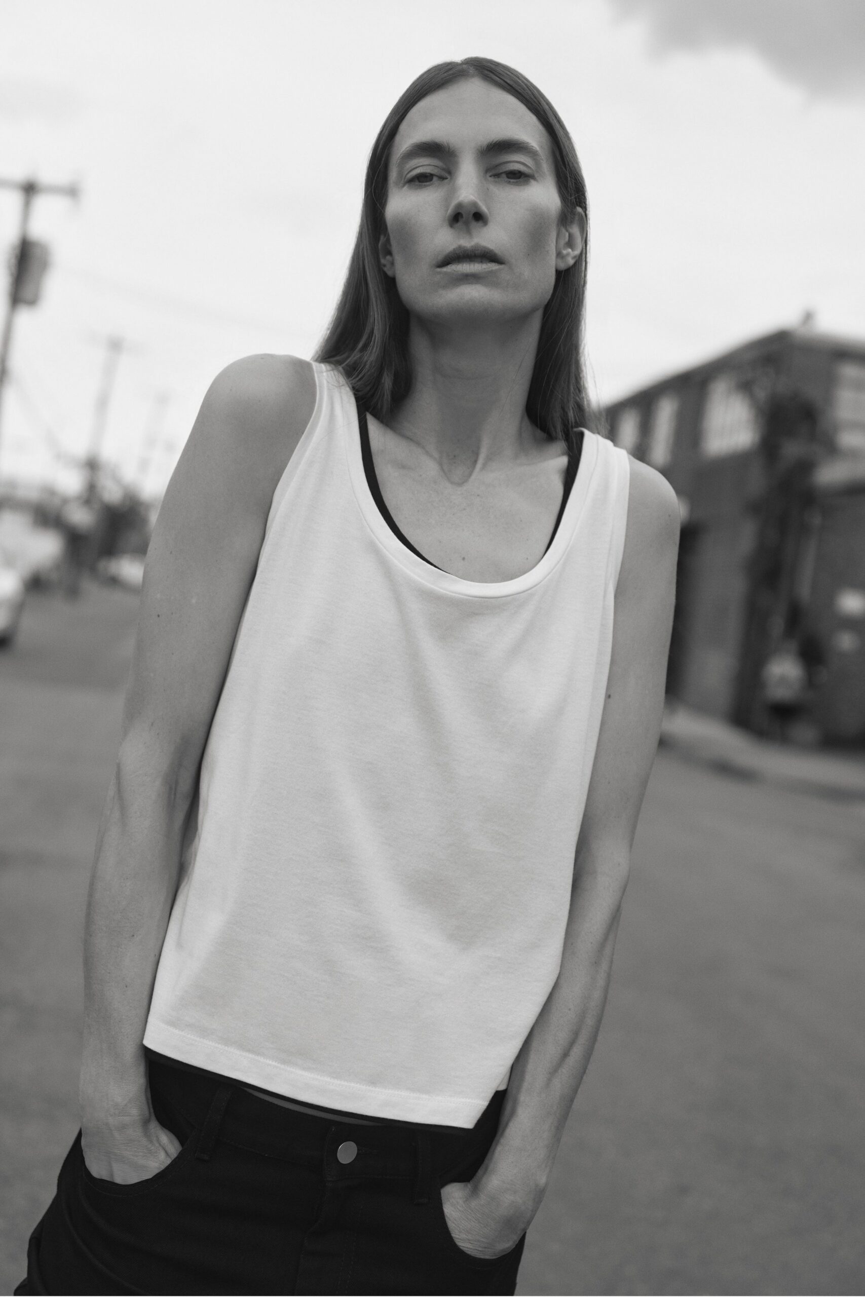 white tank-top and black pants