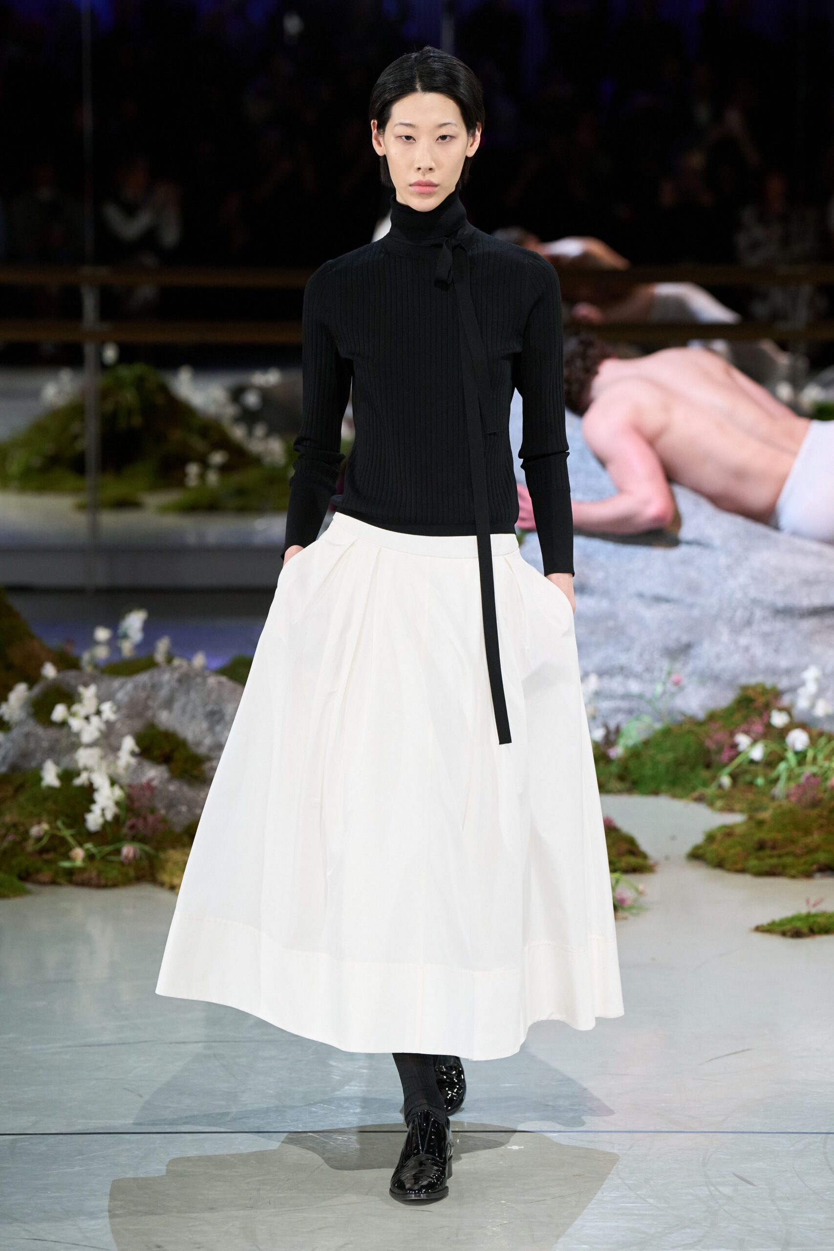 black fitted top white pleated skirt