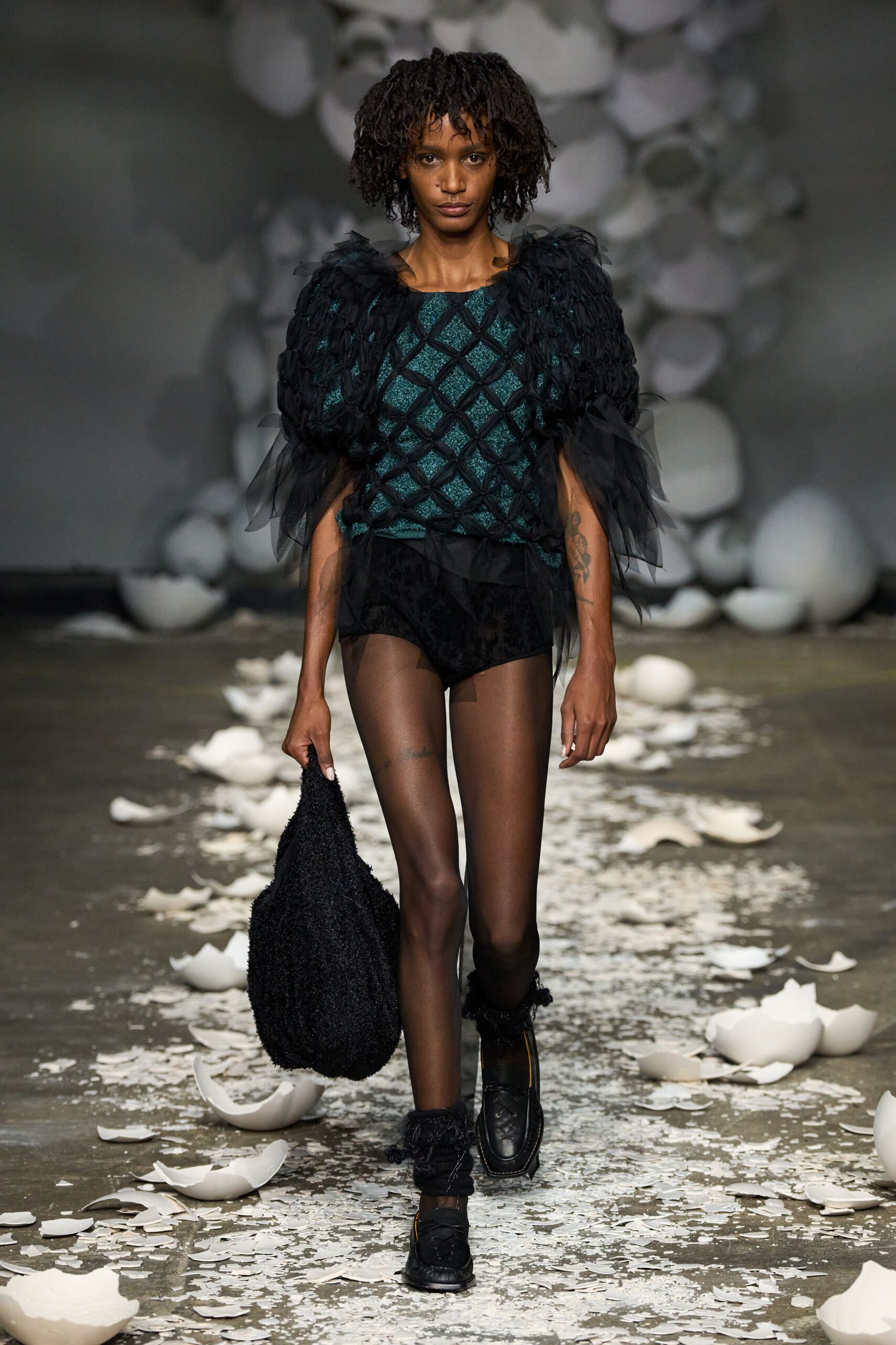 black velvet shorts with green top