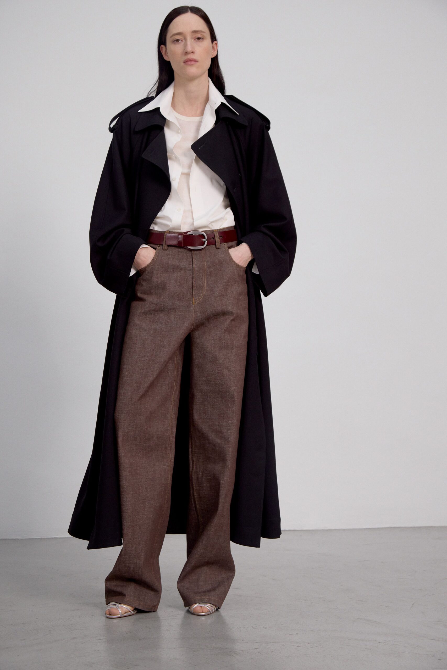 black coat white shirt brown pants