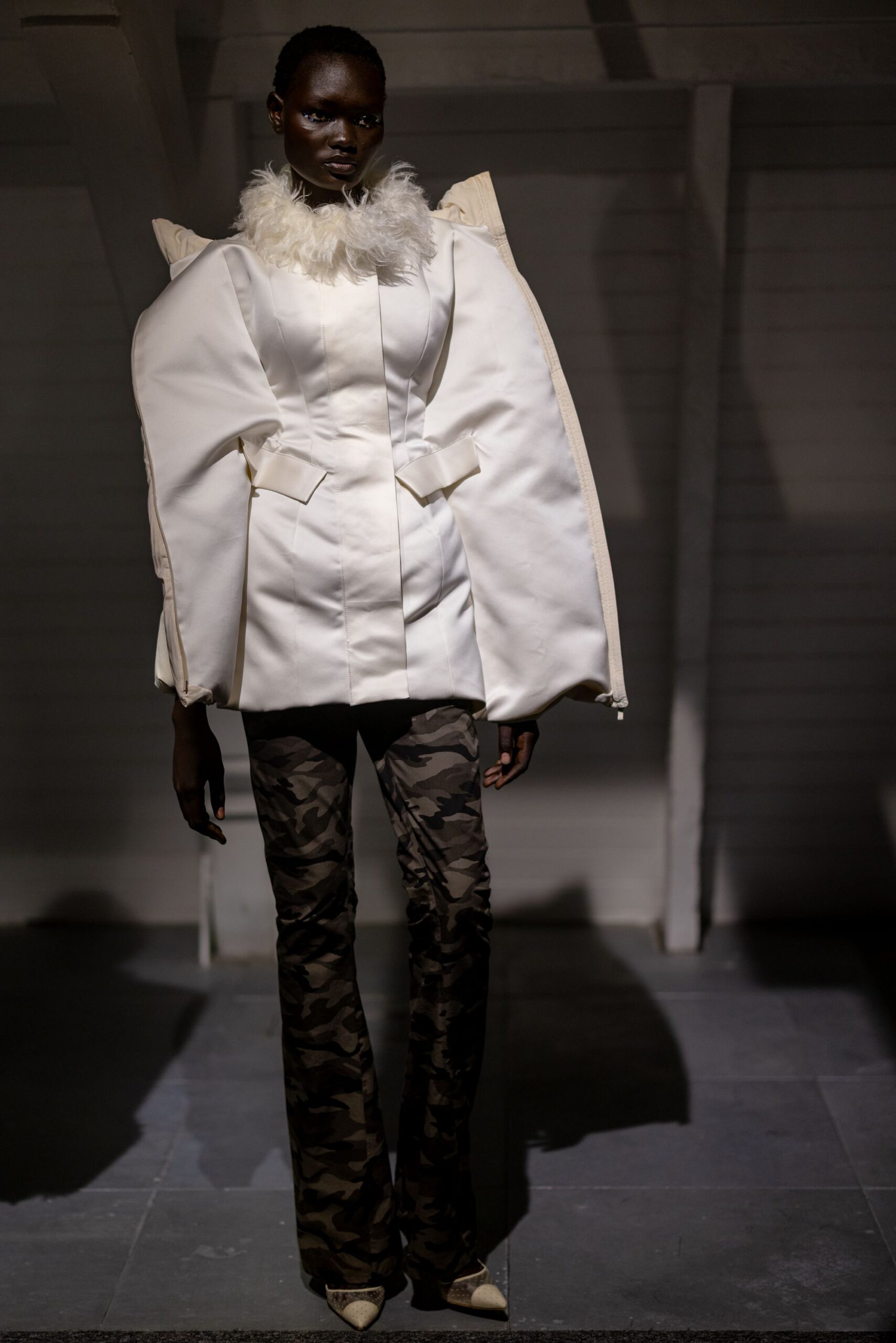 white structured jacket with camouflage pants