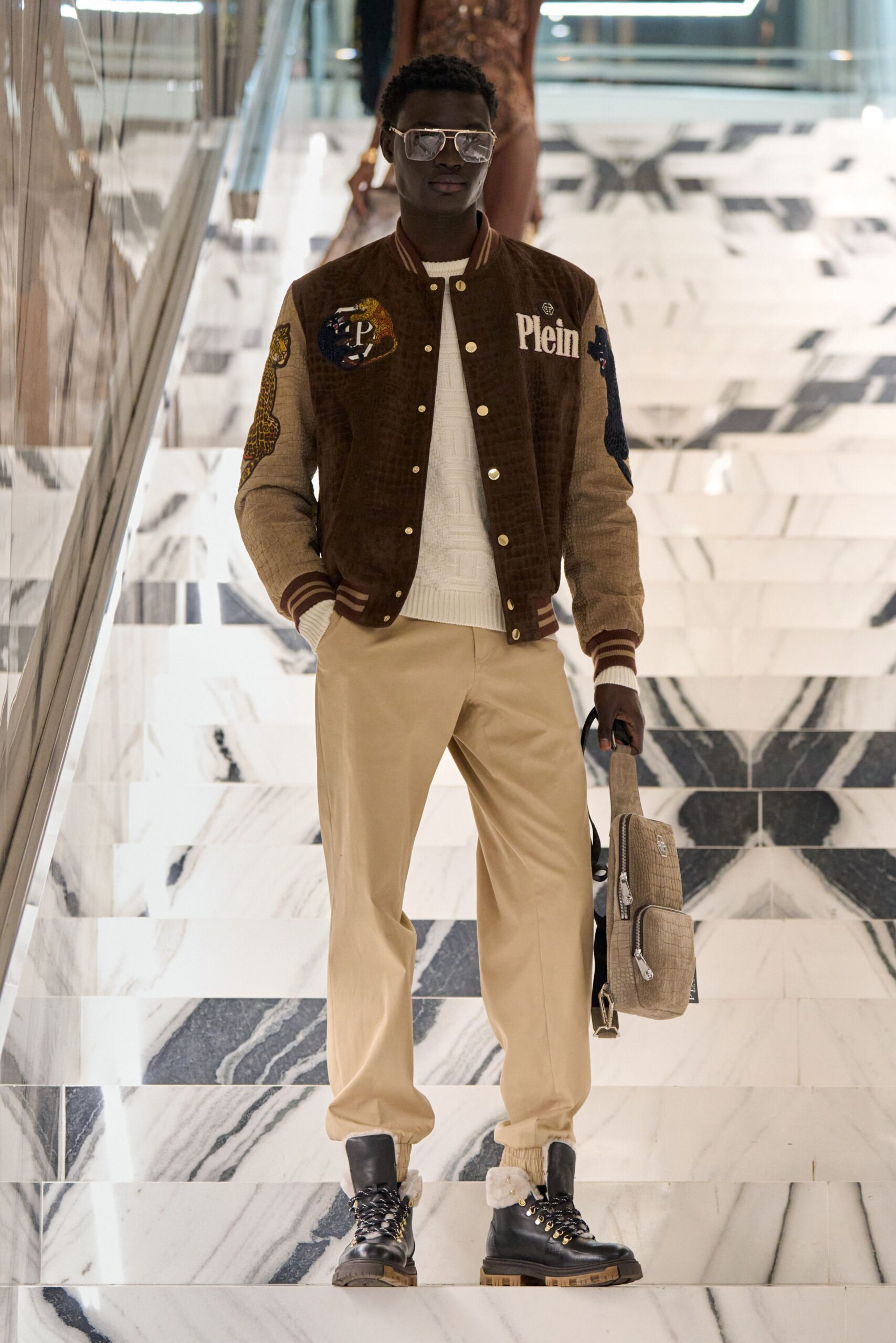 brown embroidered jacket with beige pants