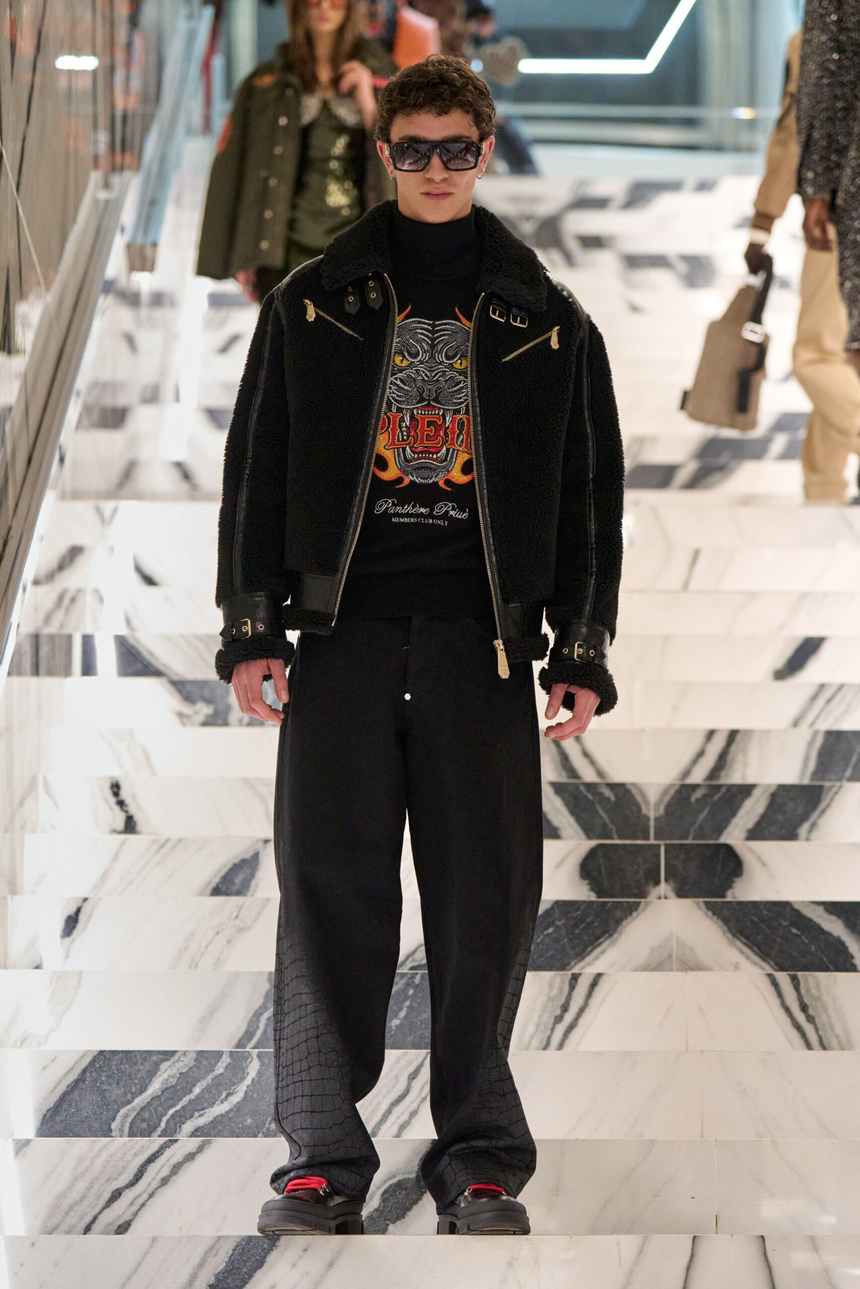 black faux-fur jacket with t-shirt and pants
