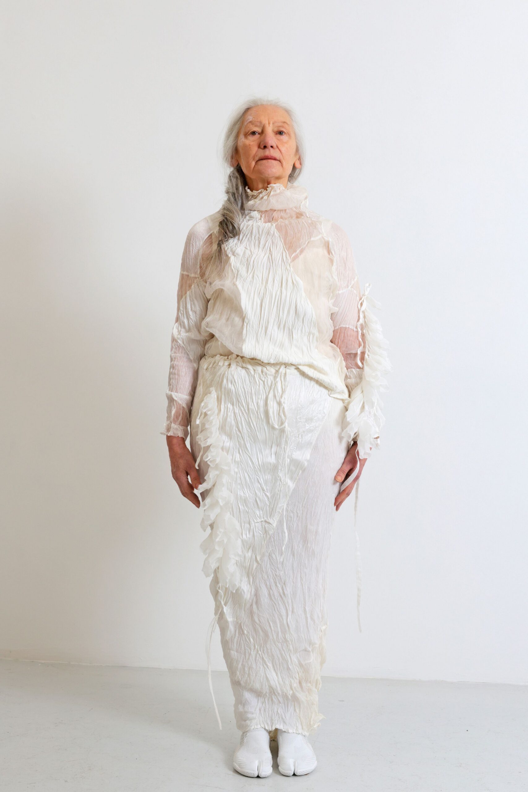 white silk long-sleeve high-neck fitted ruffled draped dress