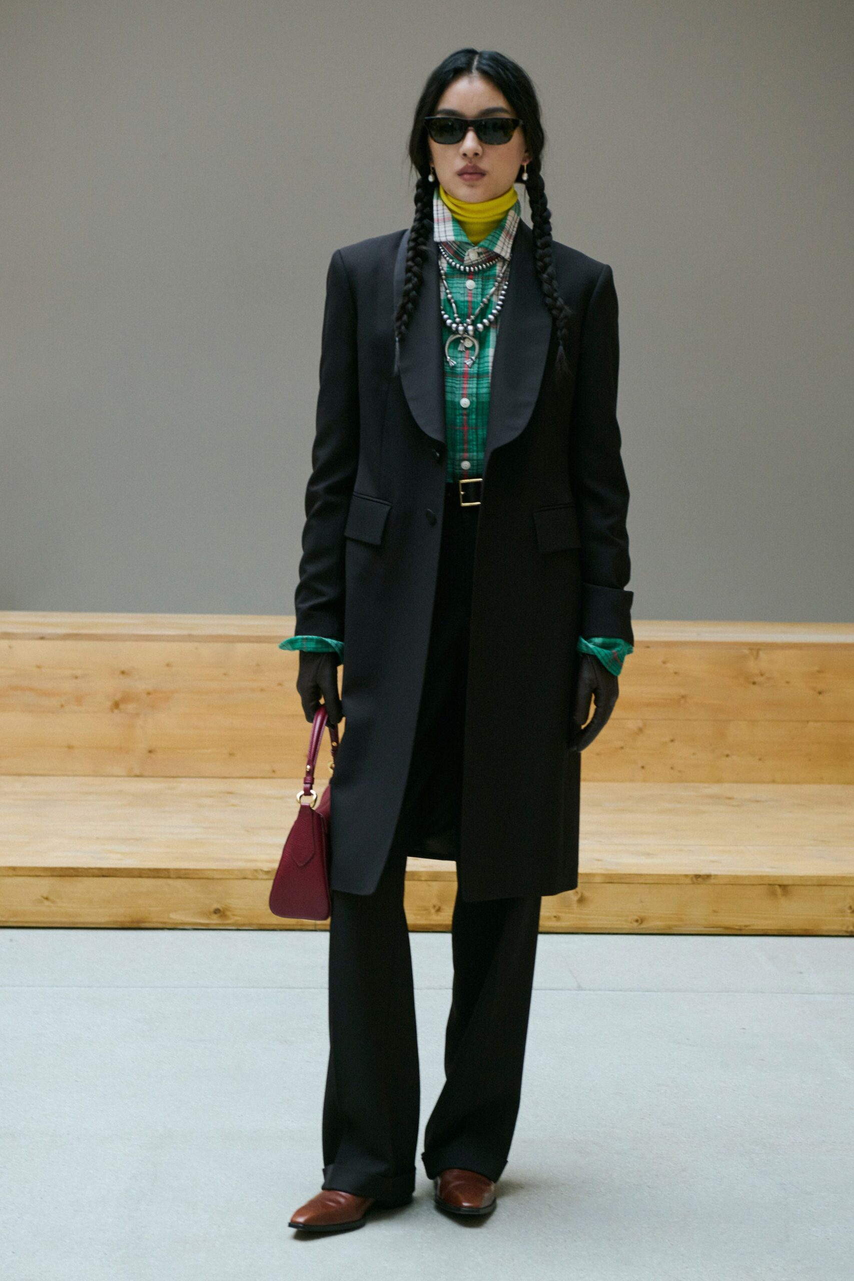 black long-sleeve collared tailored buttoned coat