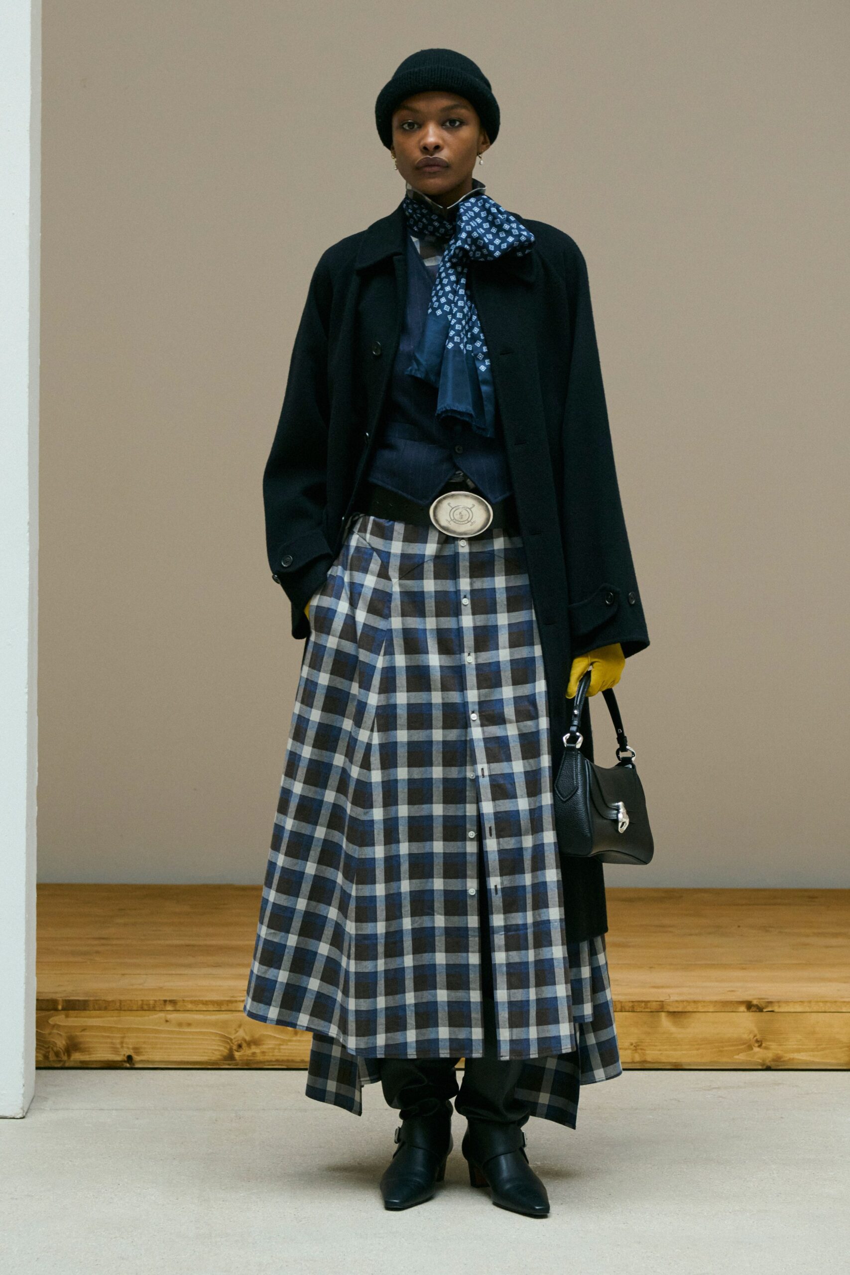black wool coat with plaid skirt
