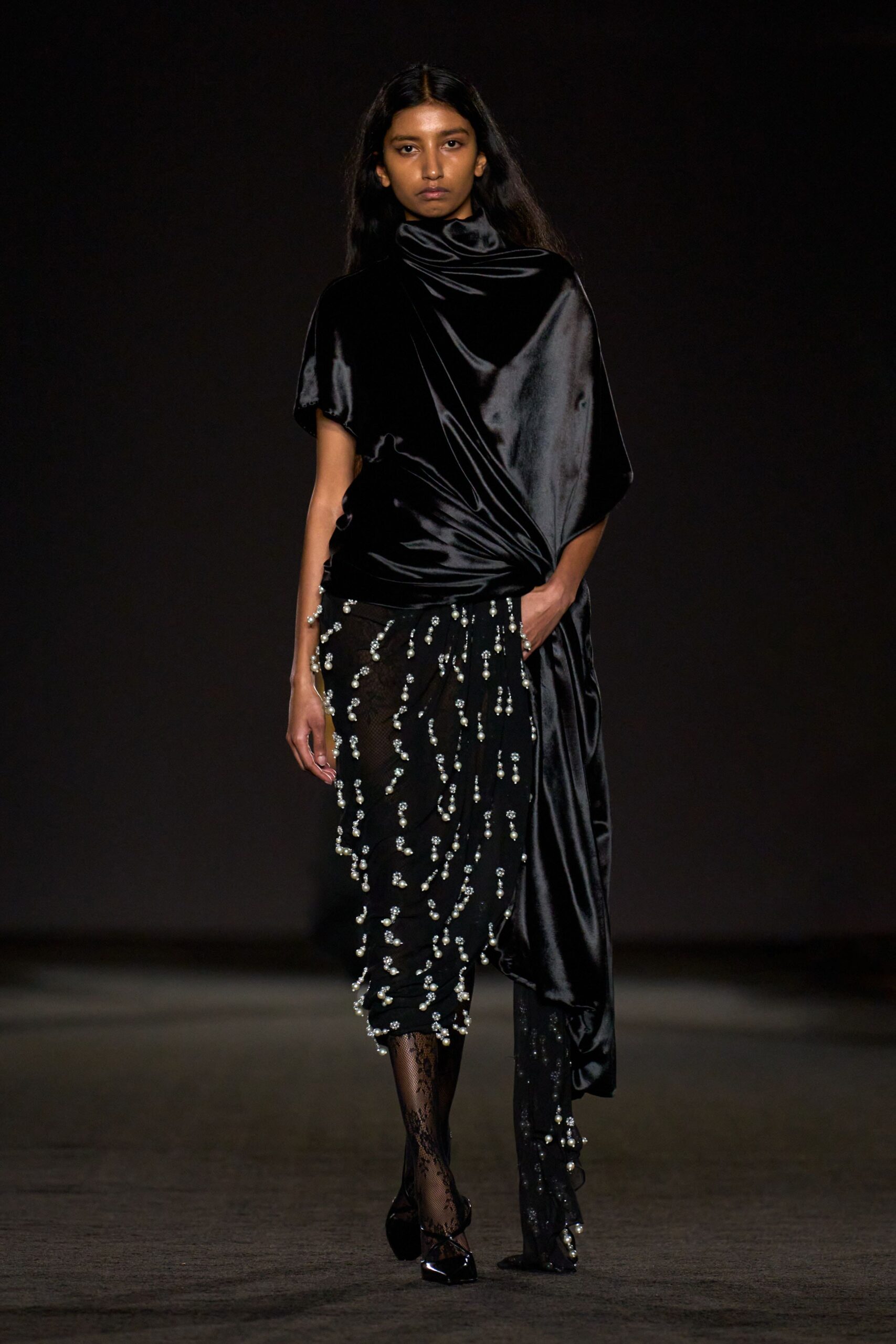 black silk sleeveless high-neck relaxed draped flowing top