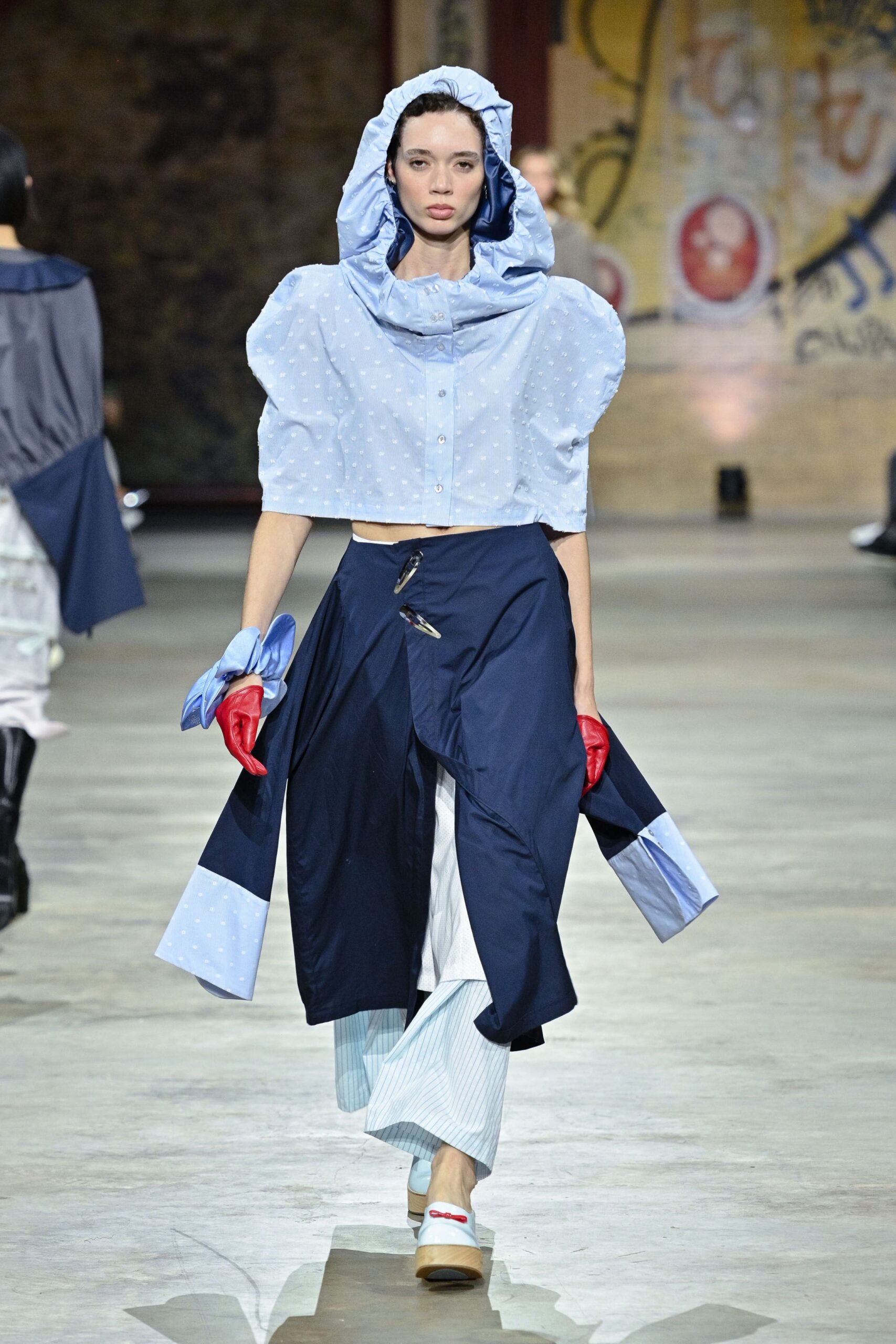 blue polka-dot hooded top with navy pants