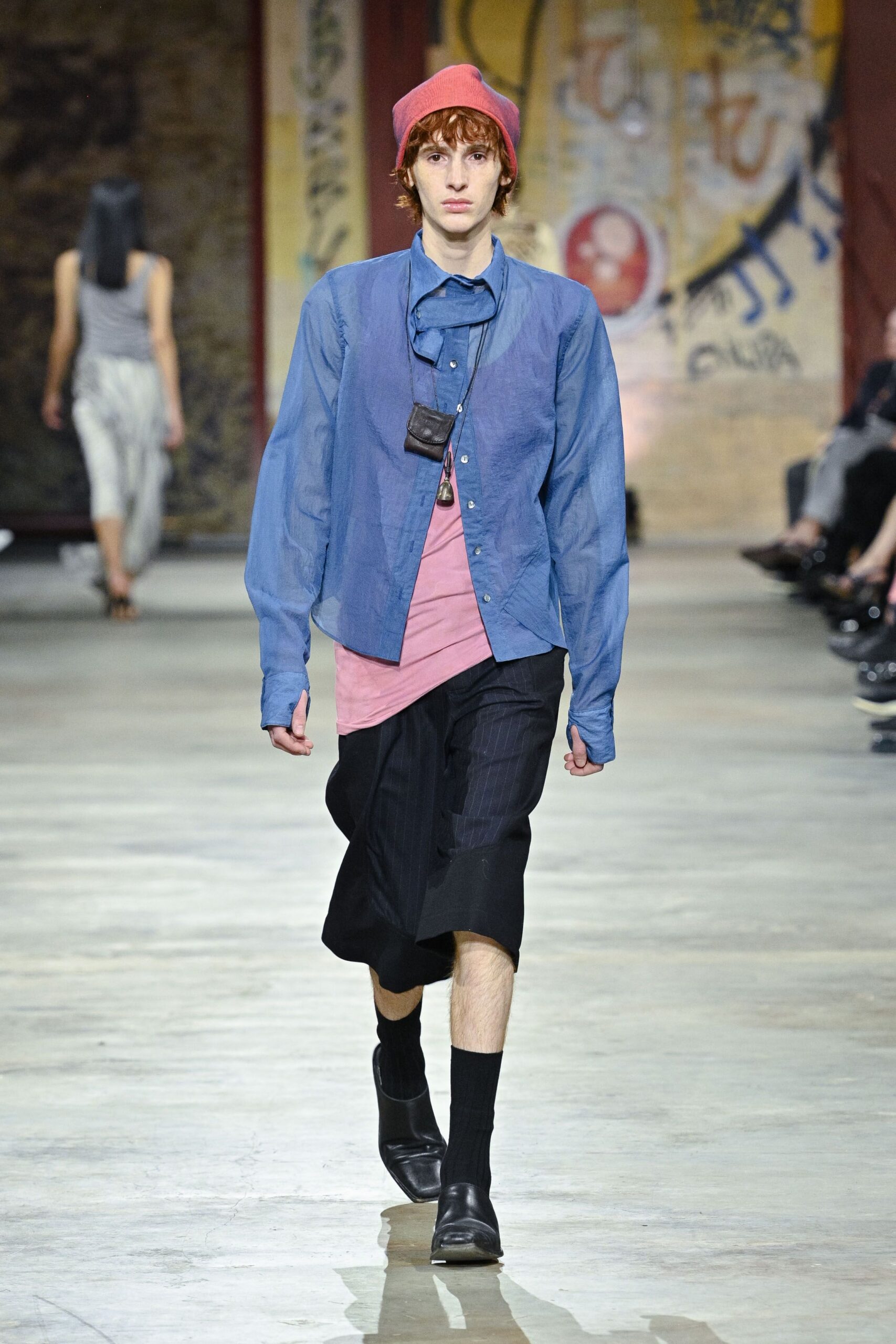 blue shirt pink top black shorts