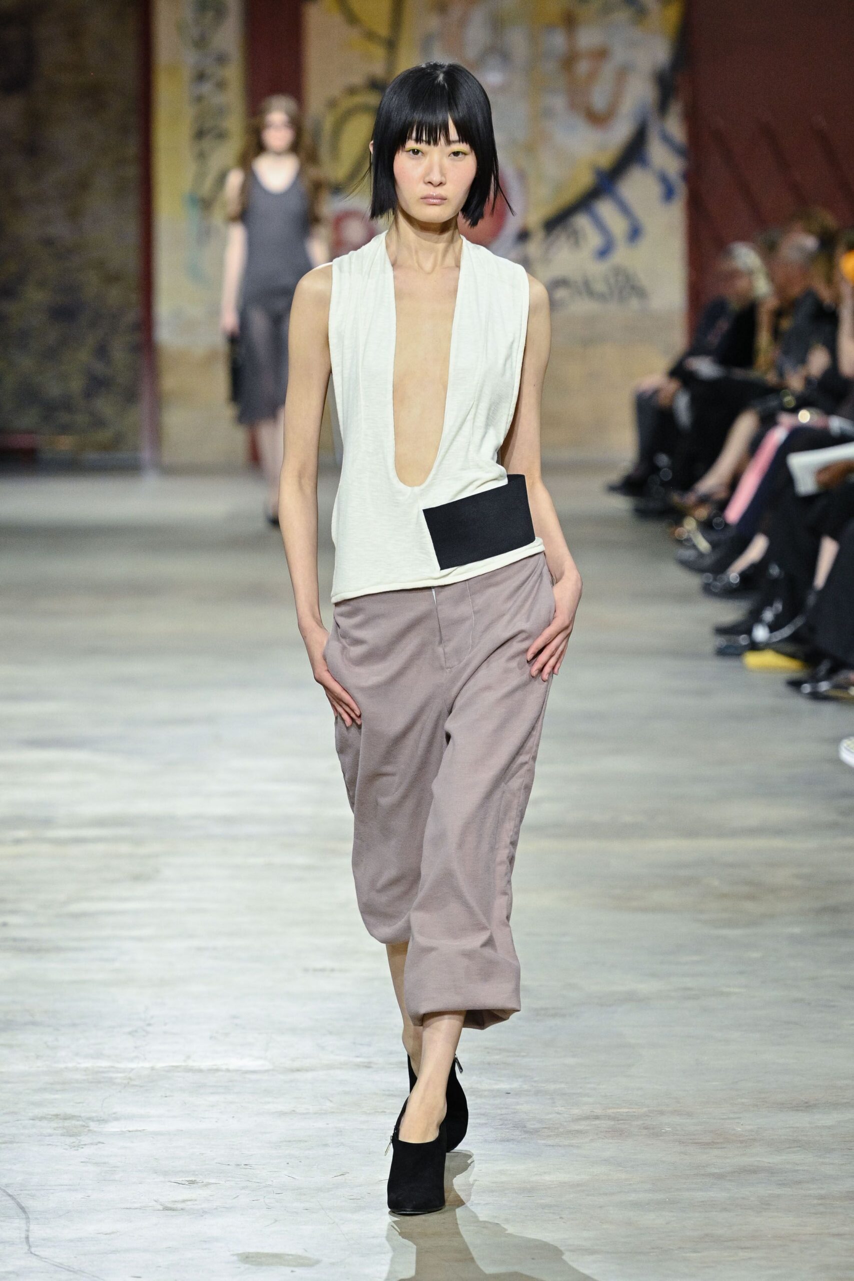 white fitted sleeveless top with beige wide-leg pants