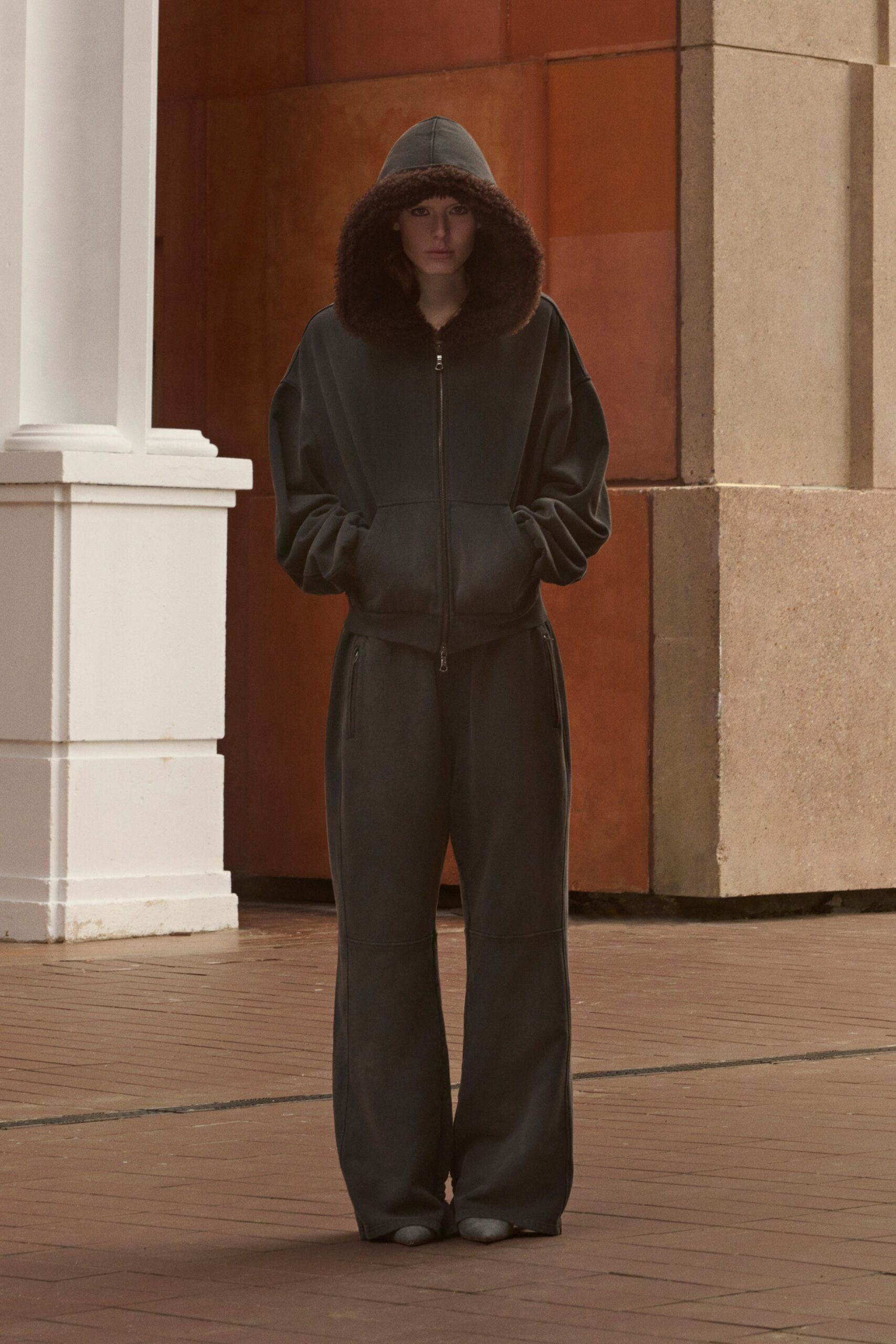 black faux-fur hooded long-sleeve relaxed zippered jumpsuit