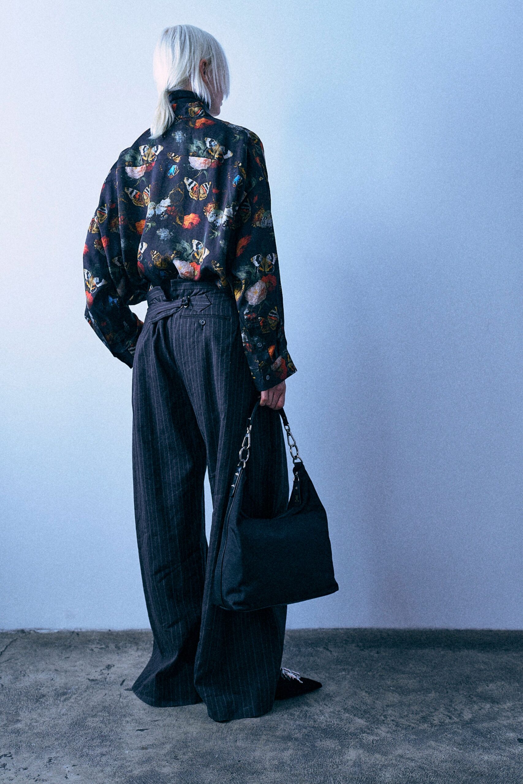 black multi printed shirt with gray pants