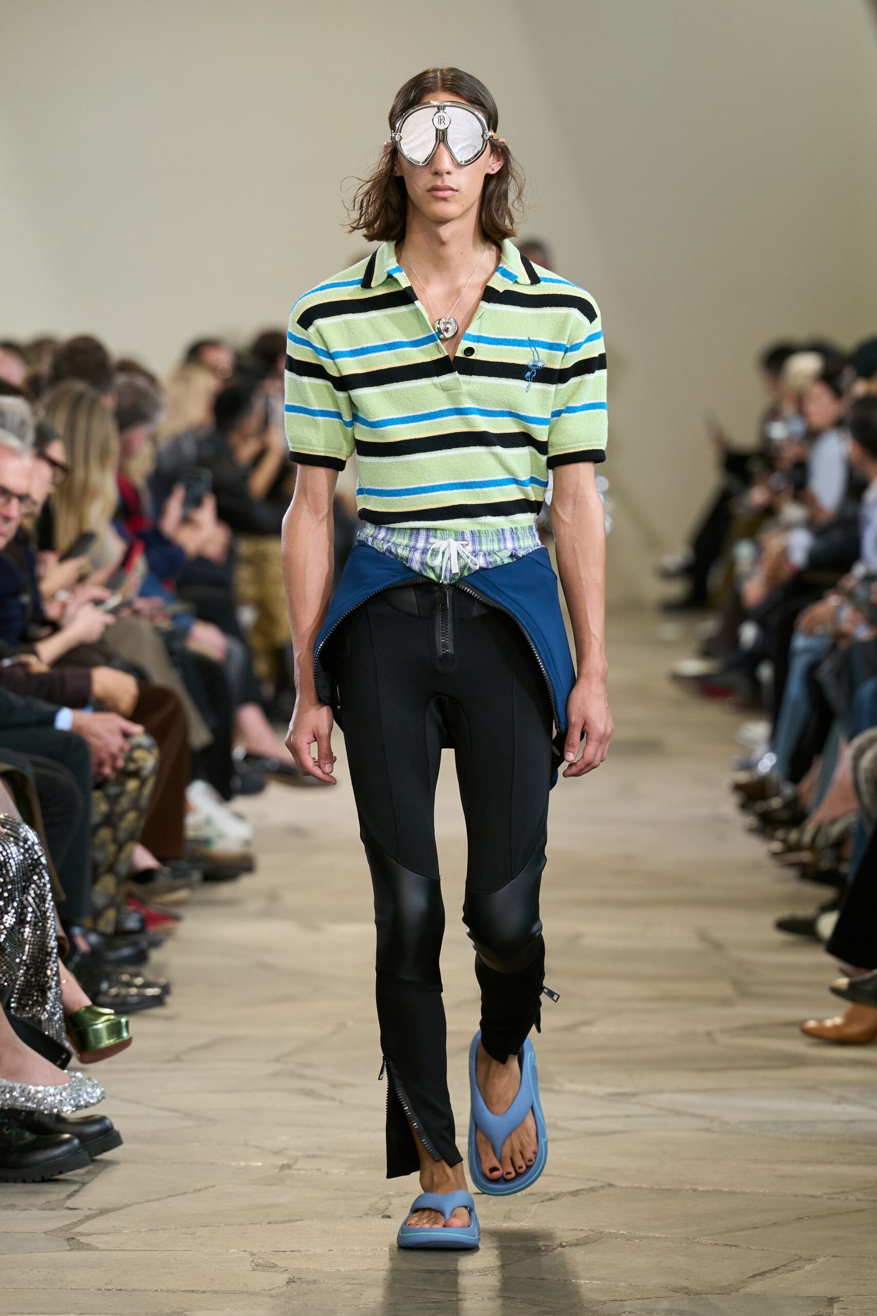 striped green shirt with black pants