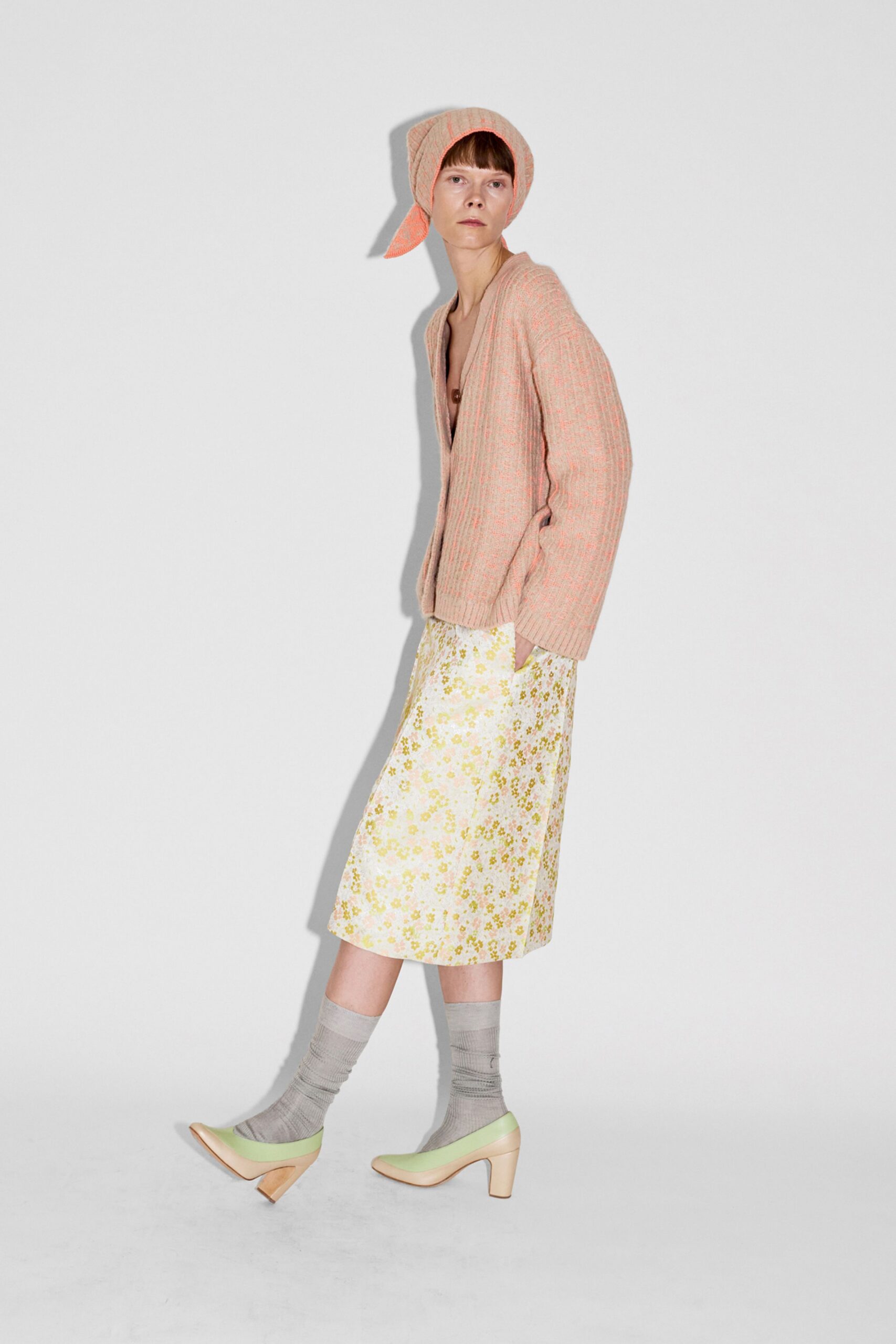 pink cardigan yellow floral skirt