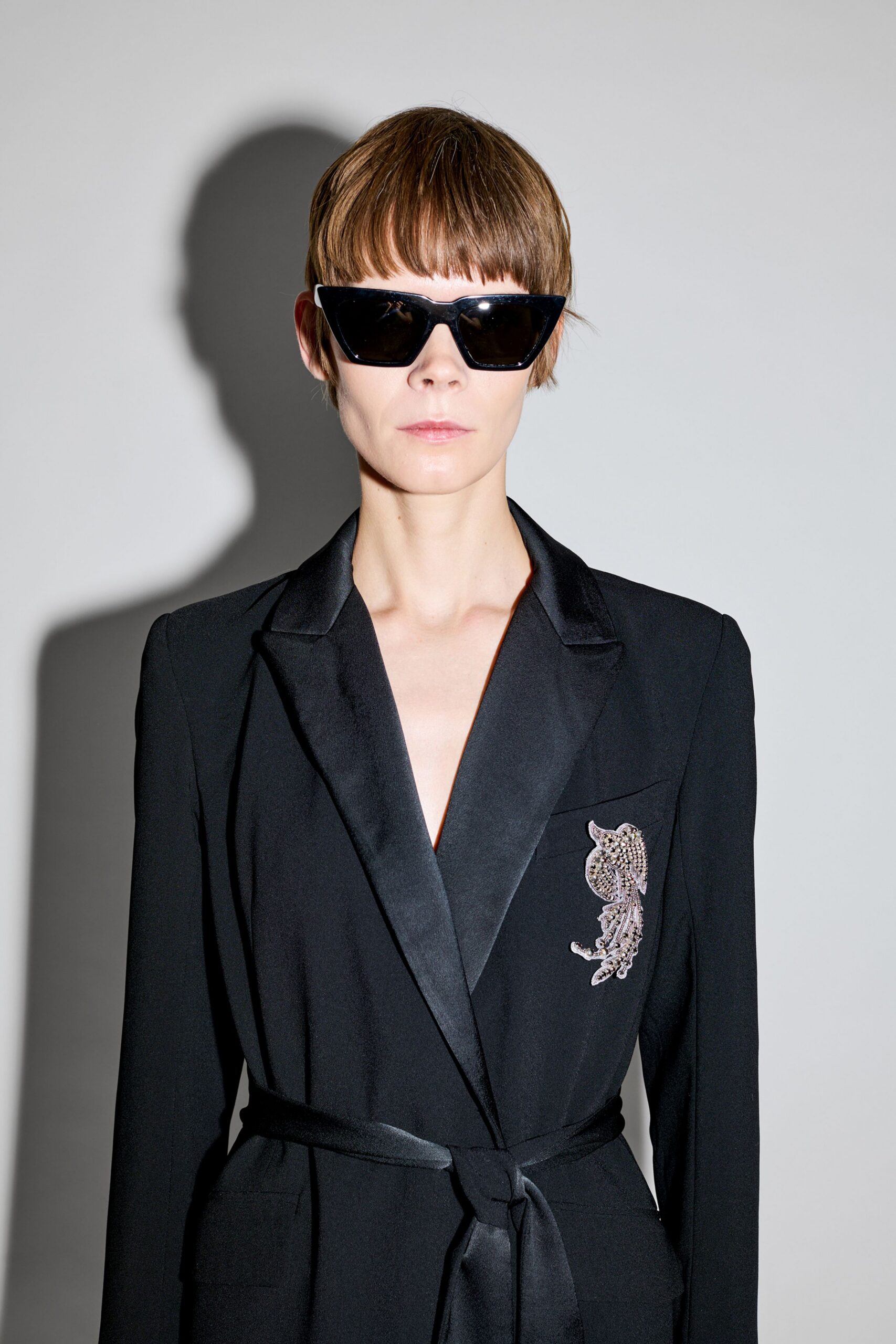 black tailored blazer with sunglasses