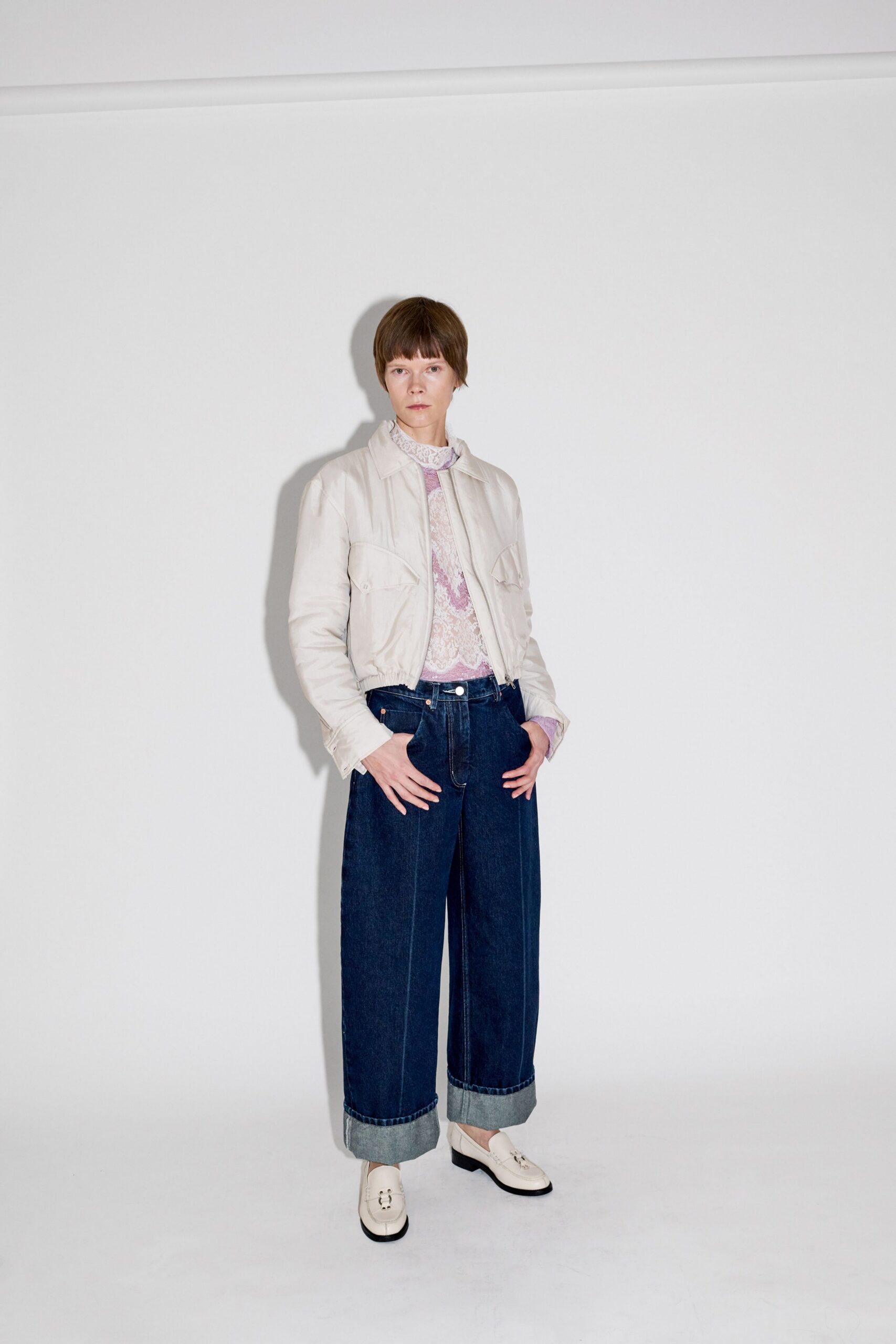 white jacket pink shirt blue pants