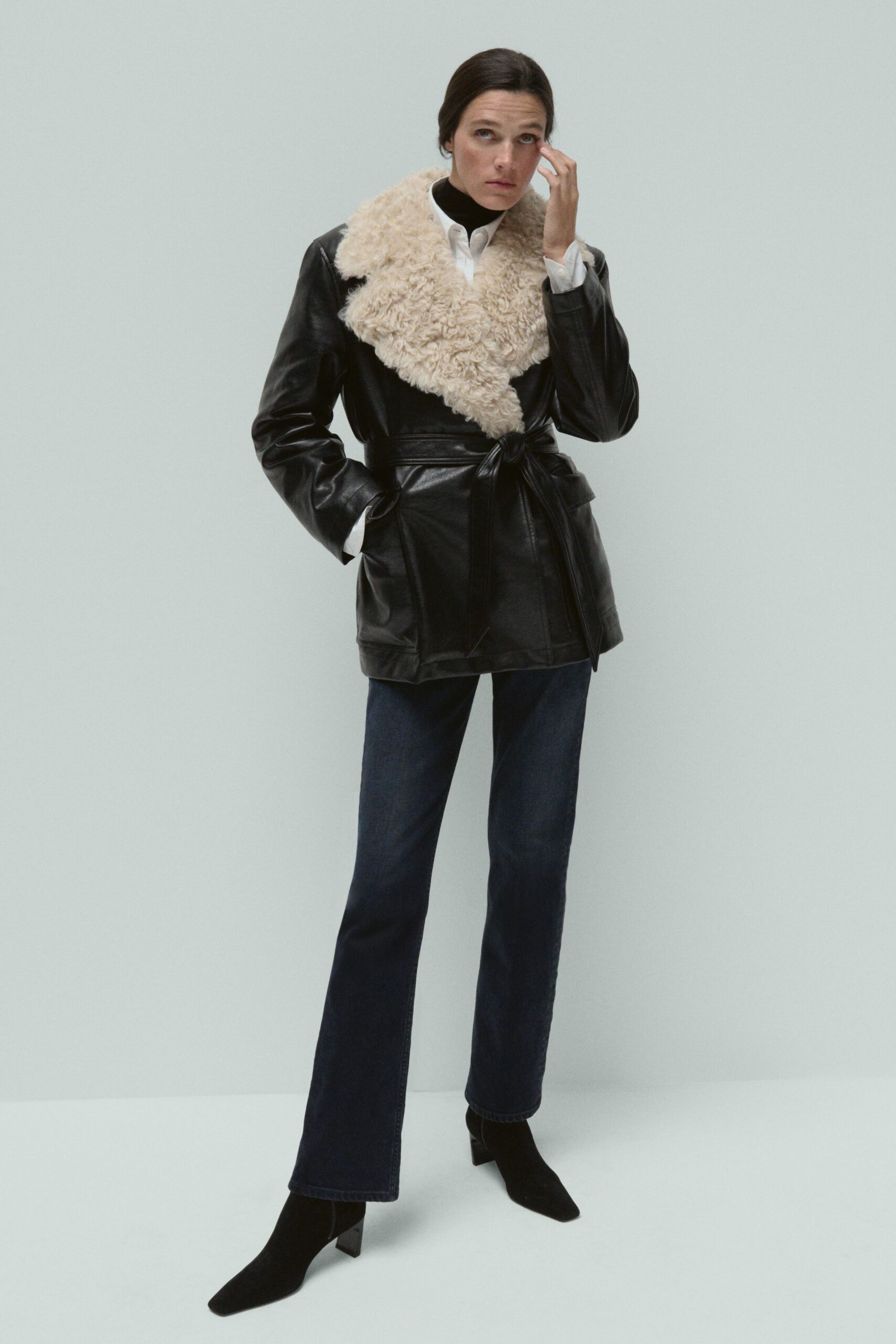 black leather long-sleeve collared fitted belted jacket