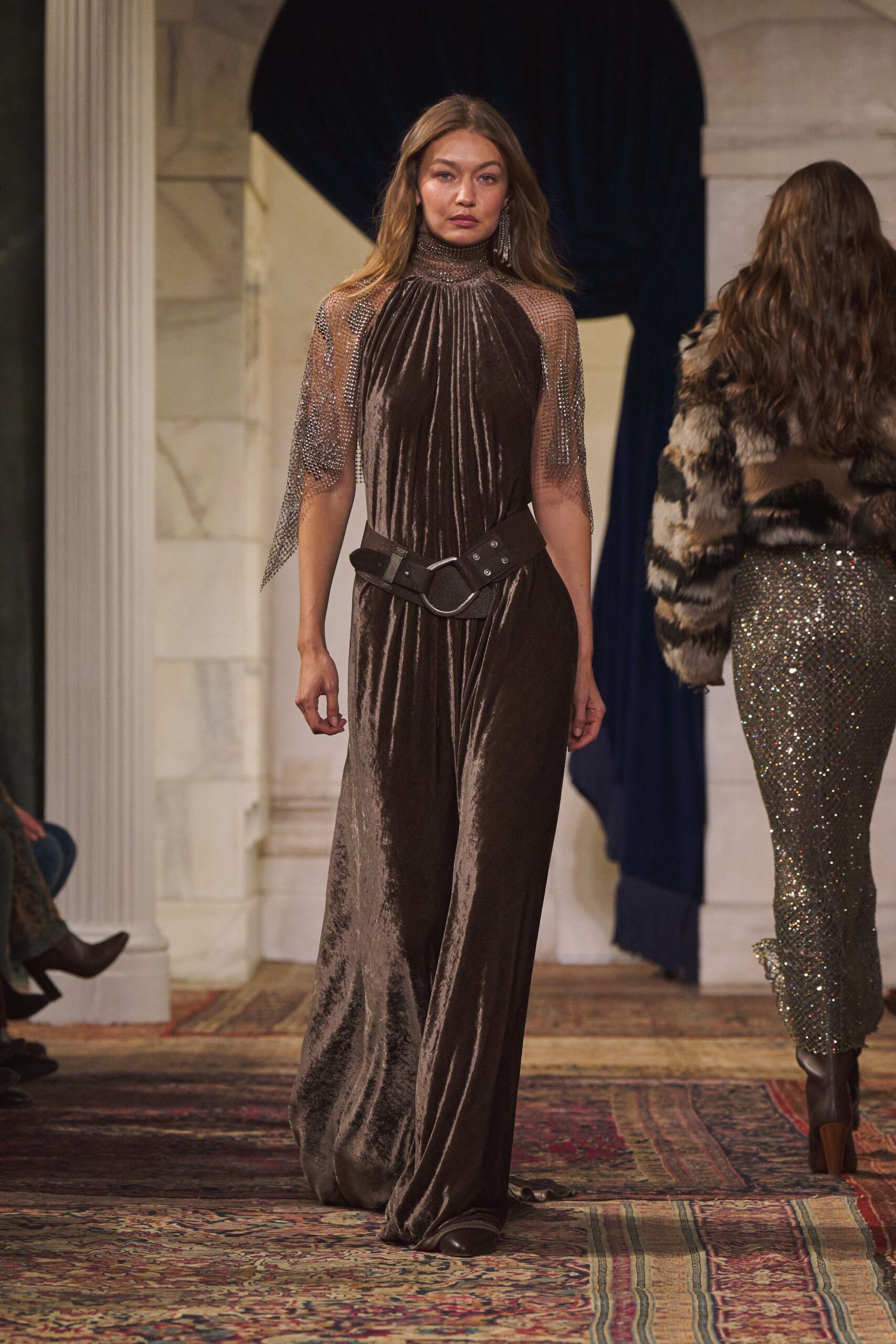 brown velvet sleeveless high-neck fitted draped flowing gown