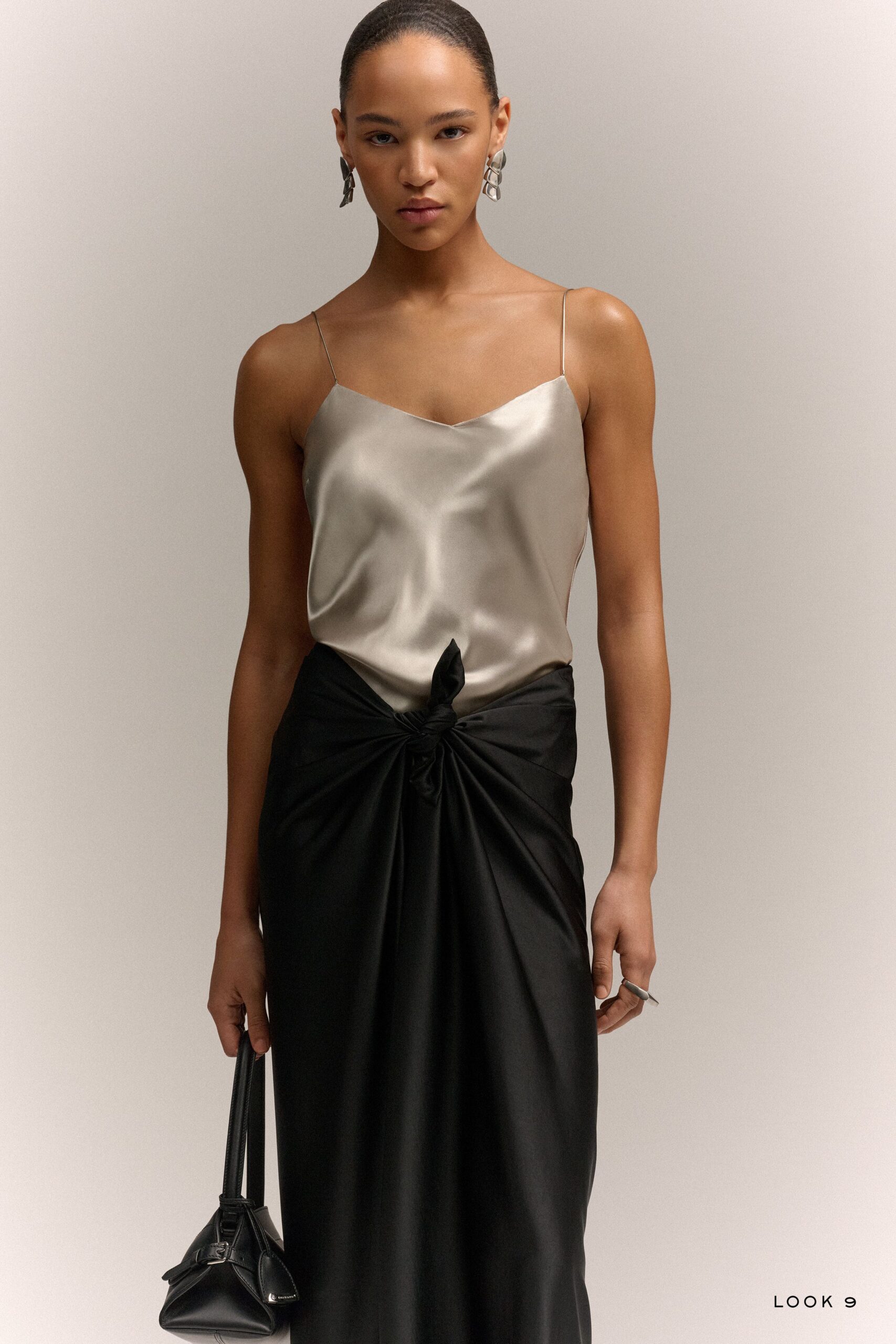 beige silk sleeveless v-neck fitted top