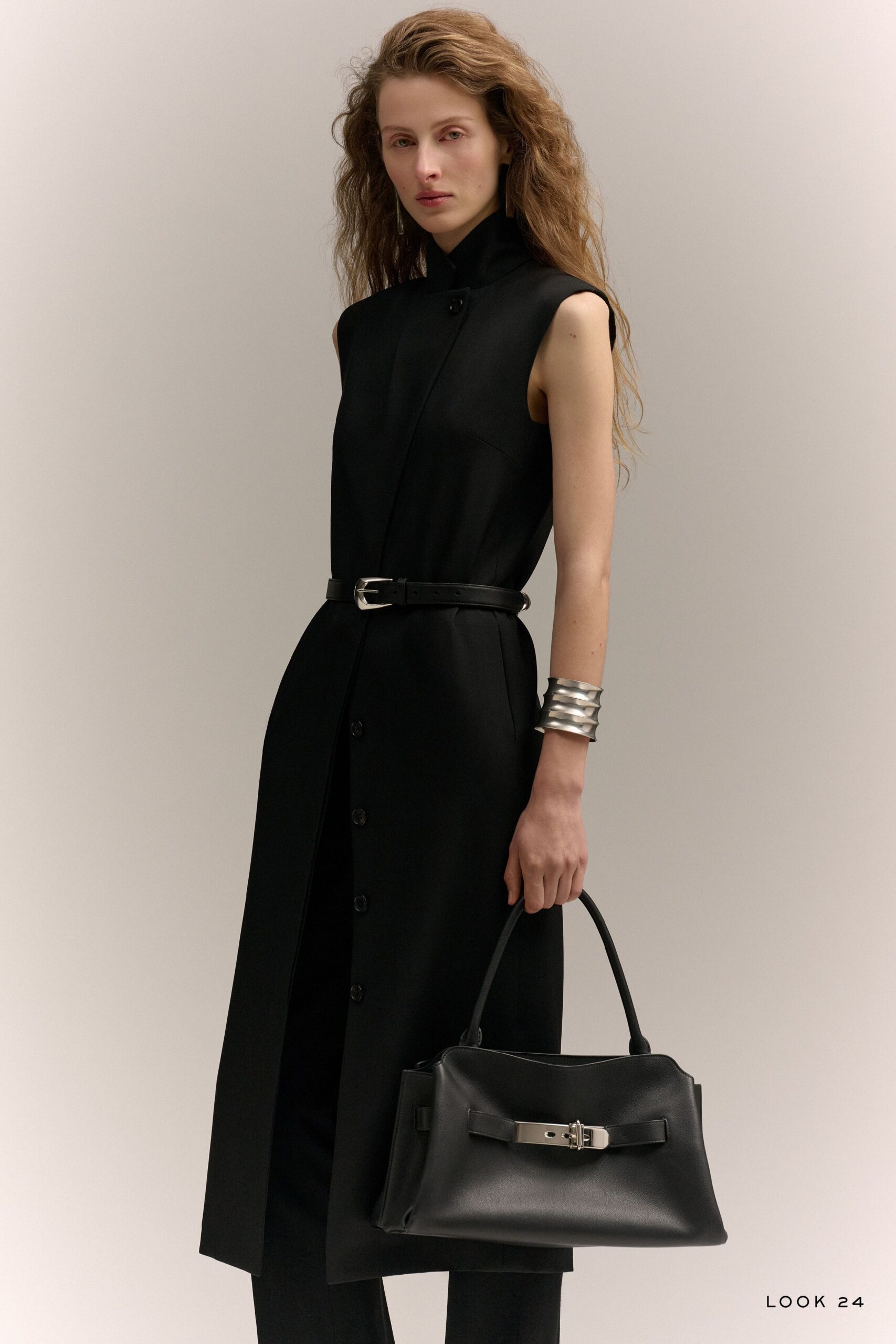black fitted sleeveless dress with bag