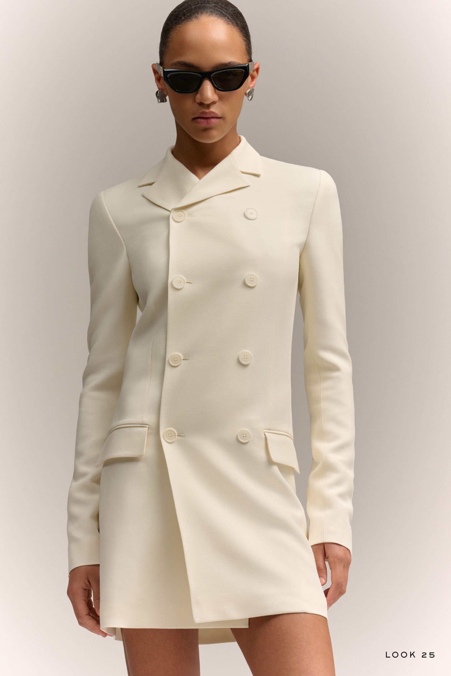 white fitted blazer with sunglasses