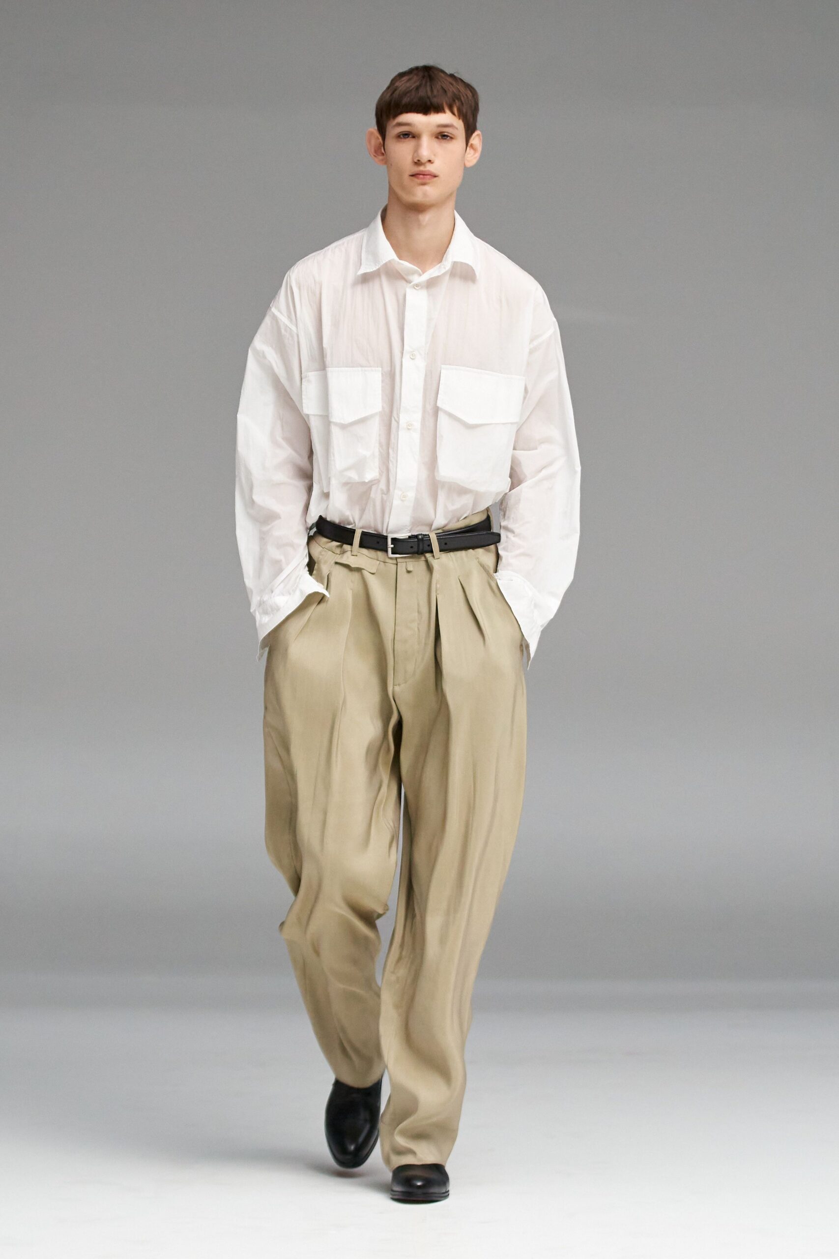 white shirt beige pants black shoes