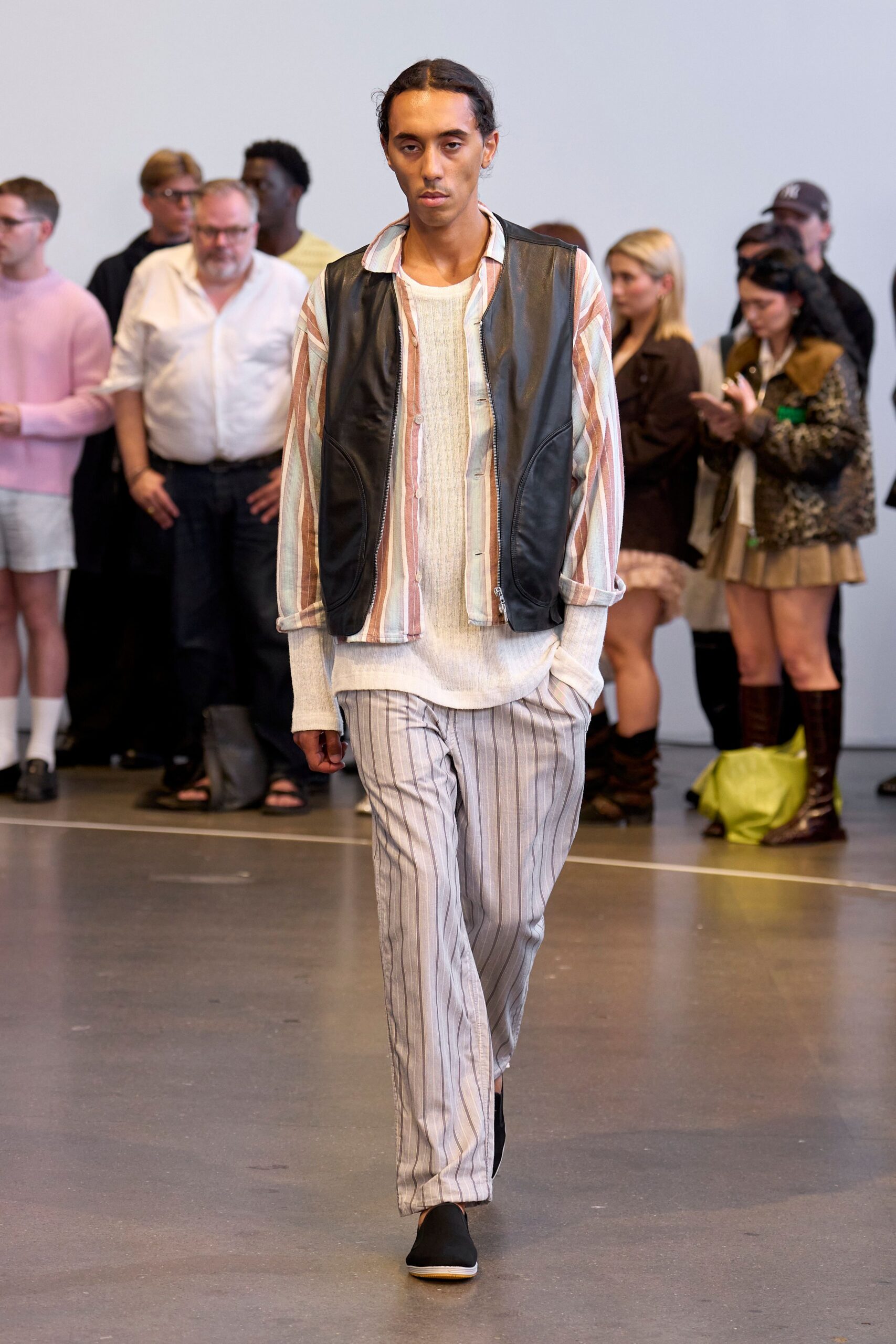 black leather vest with striped shirt and pants