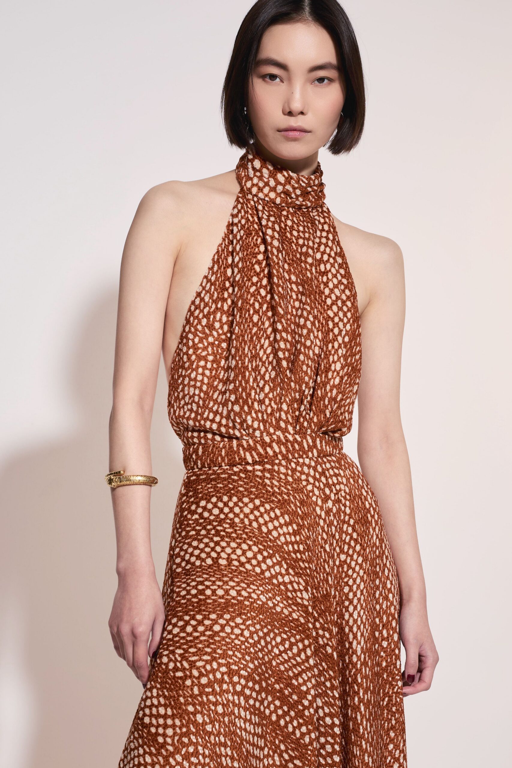 brown and white pleated halter dress