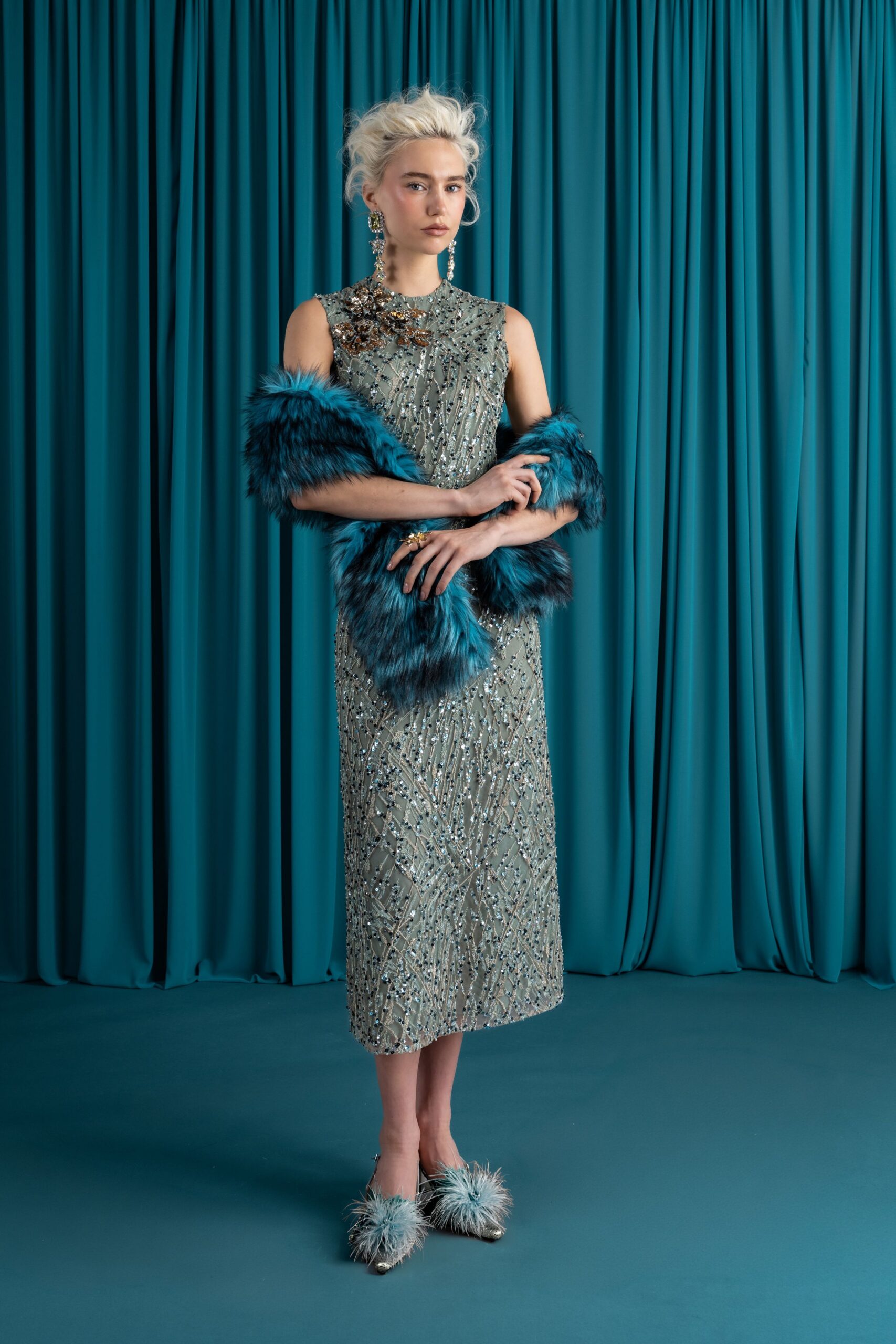 blue embroidered gown with faux-fur shawl