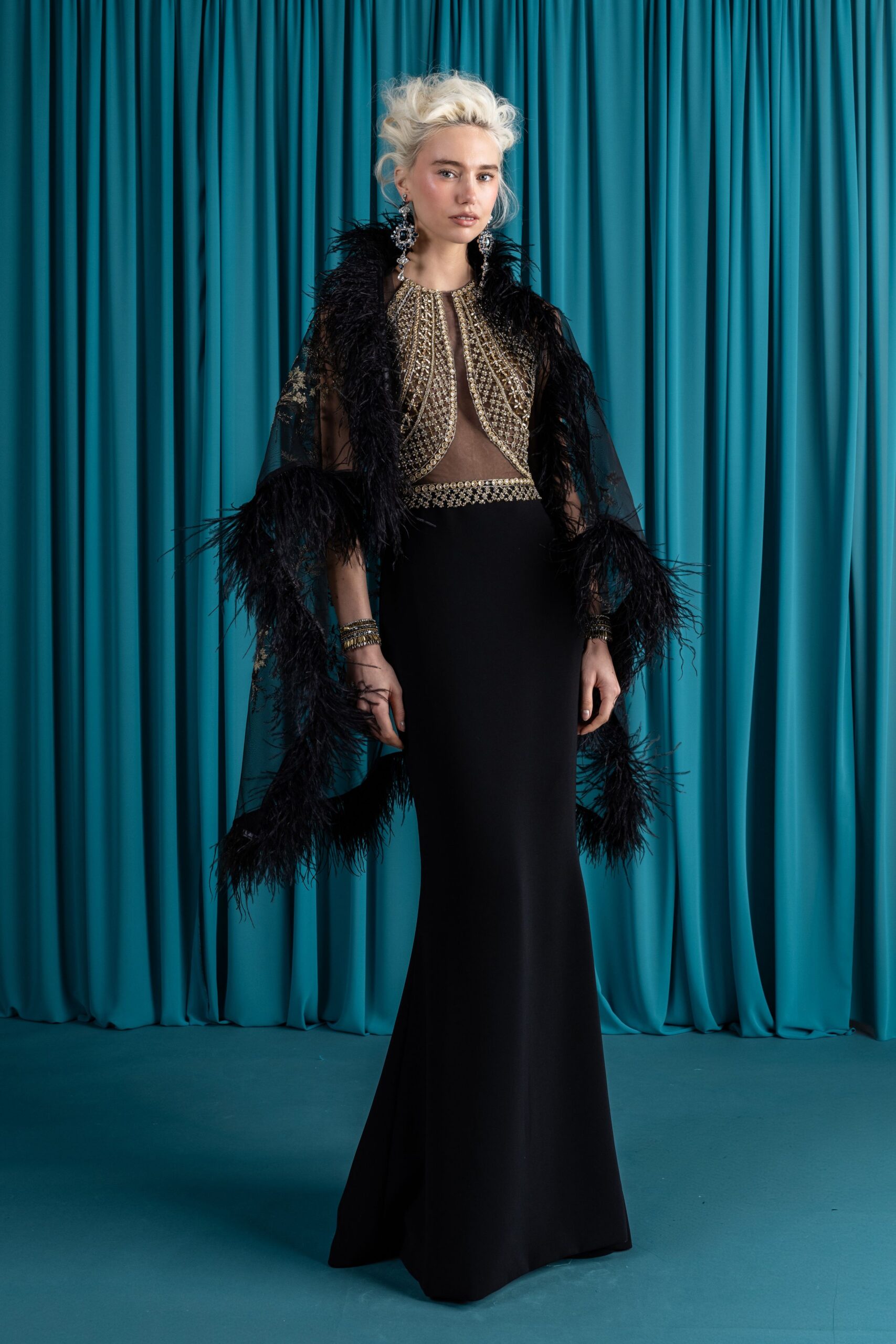 black feathered gown and cape