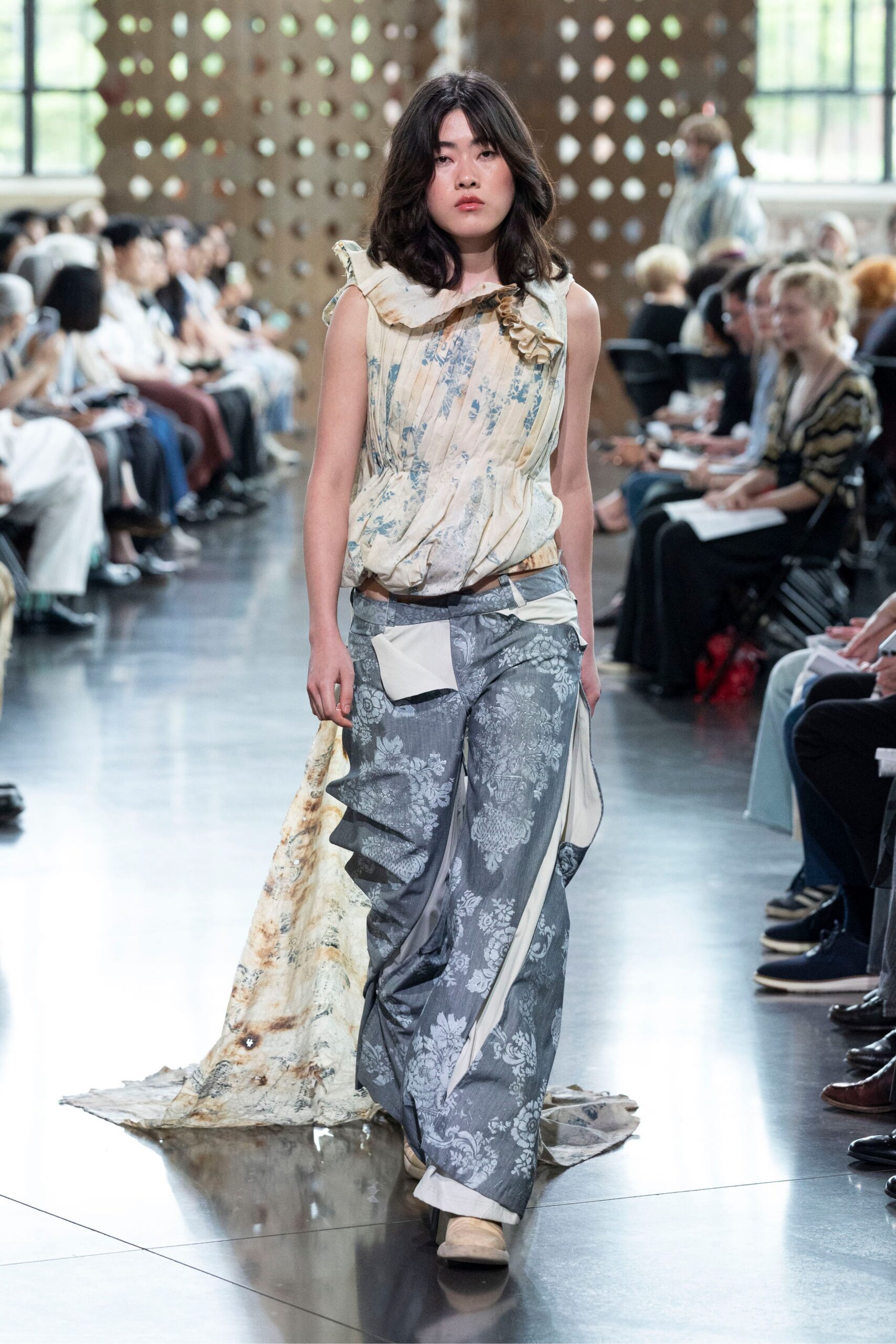 beige silk sleeveless dress with gray pants