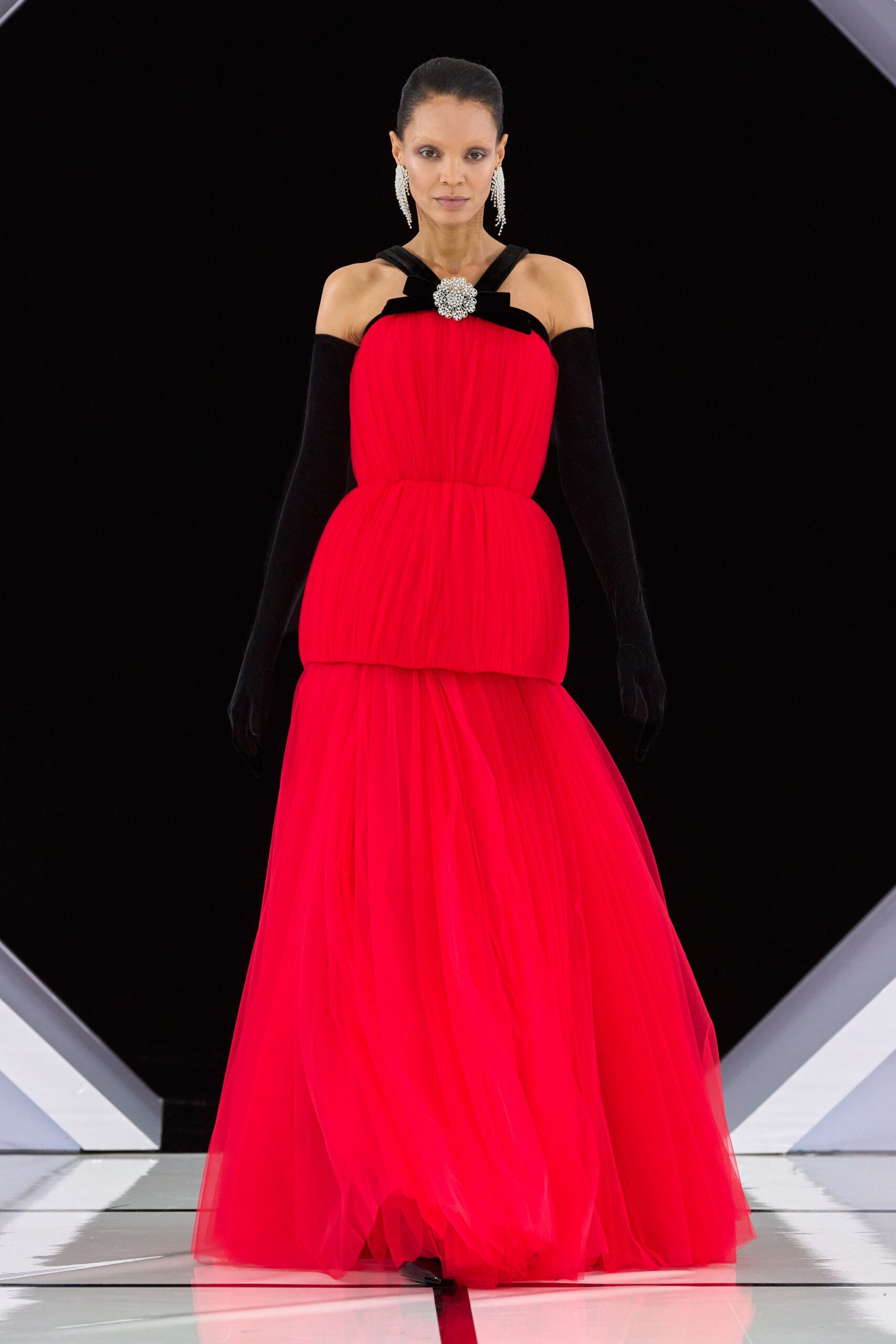 red tulle strapless fitted pleated draped flowing gown