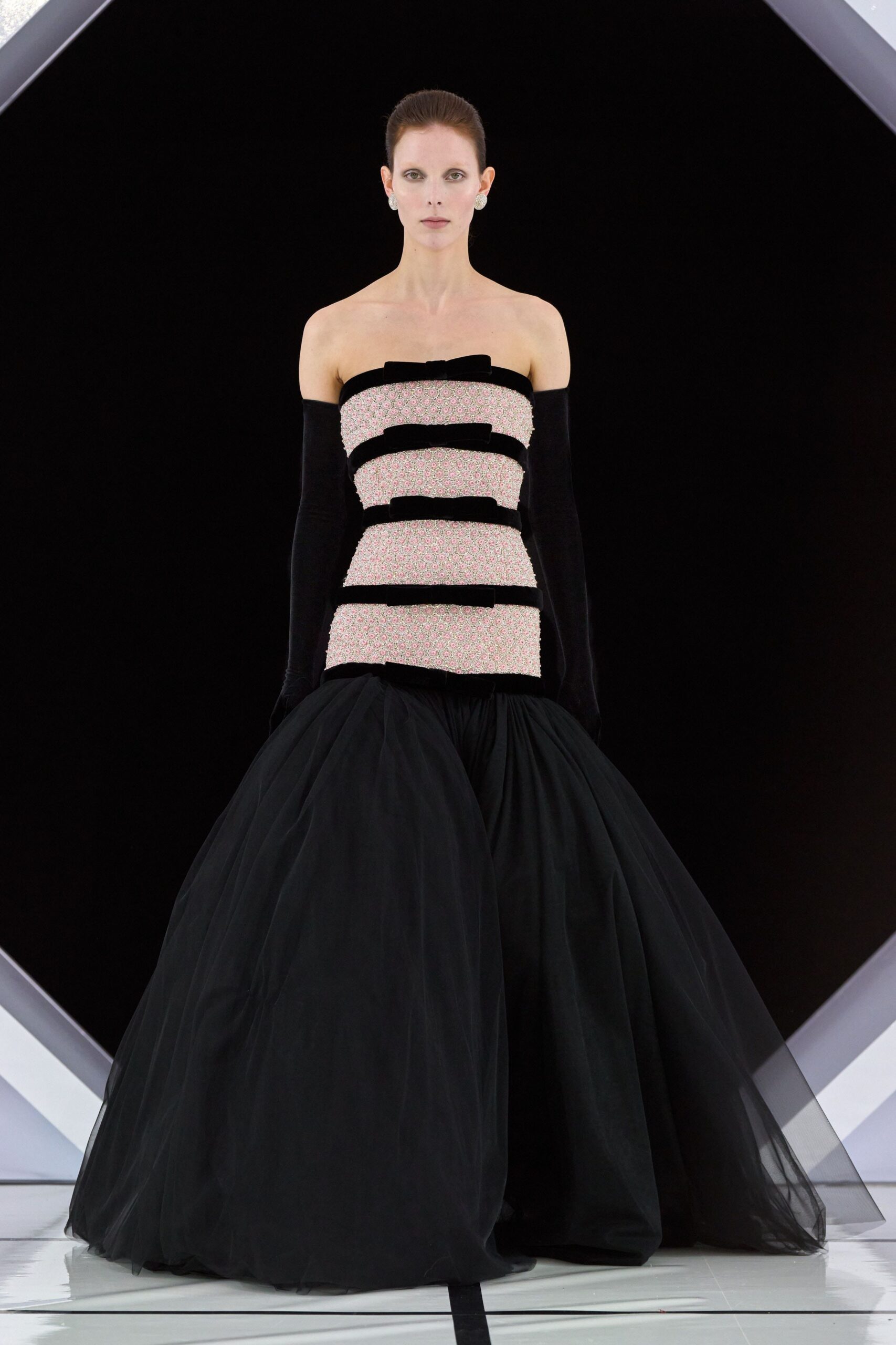 black silk strapless fitted pleated layered flowing gown