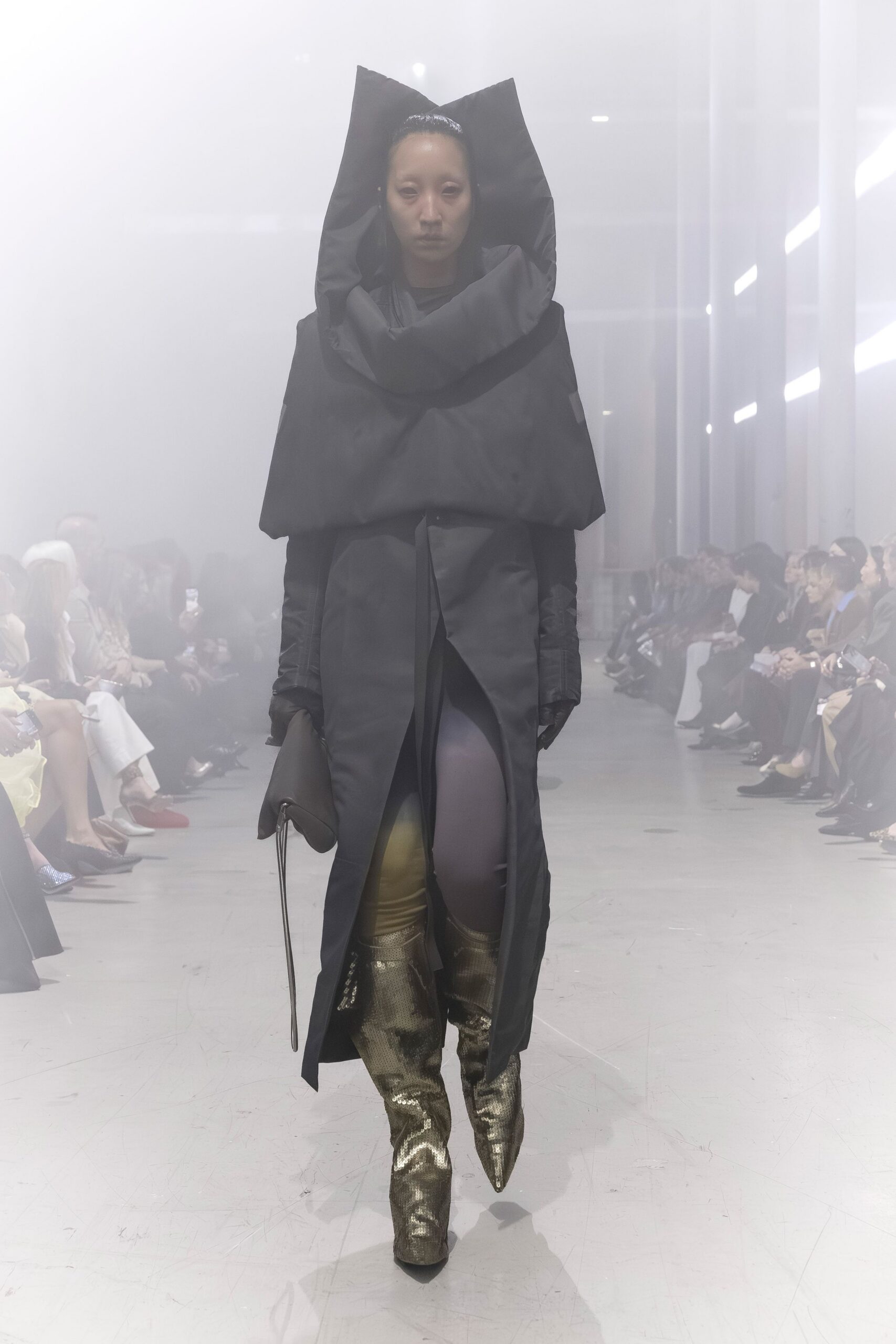 black coat with gold boots