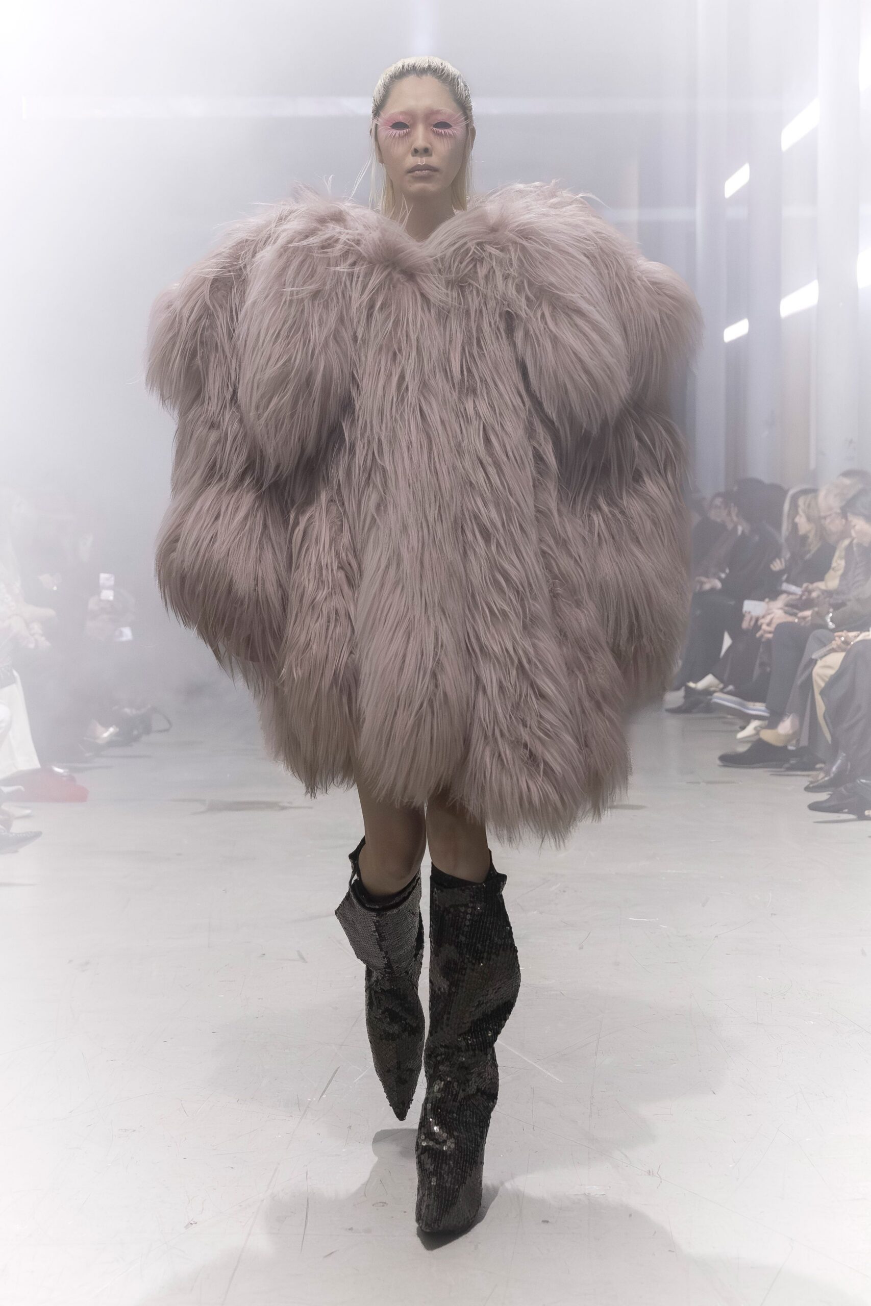 pink fur oversized coat and black boots