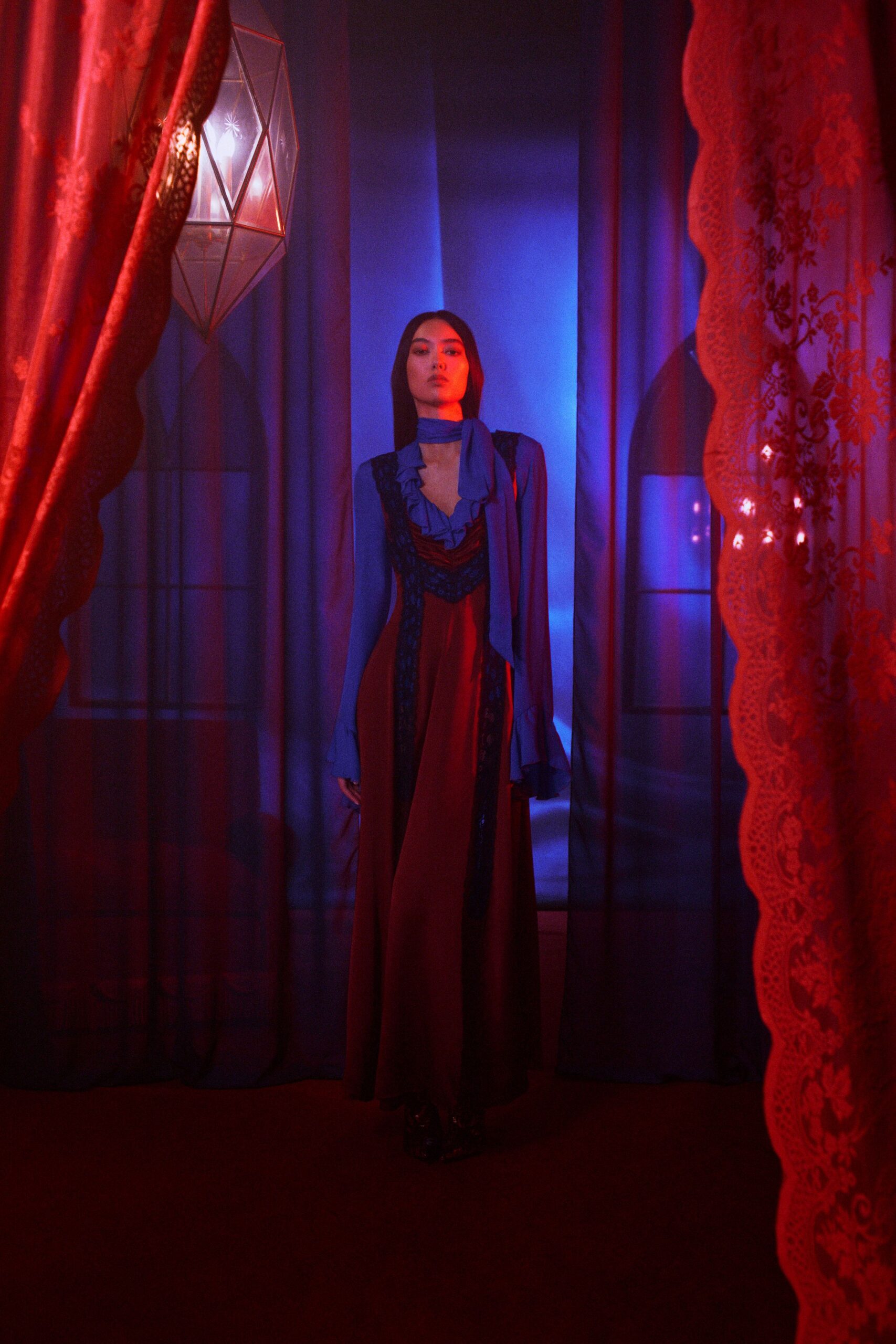 red silk long-sleeve v-neck fitted layered ruffled gown