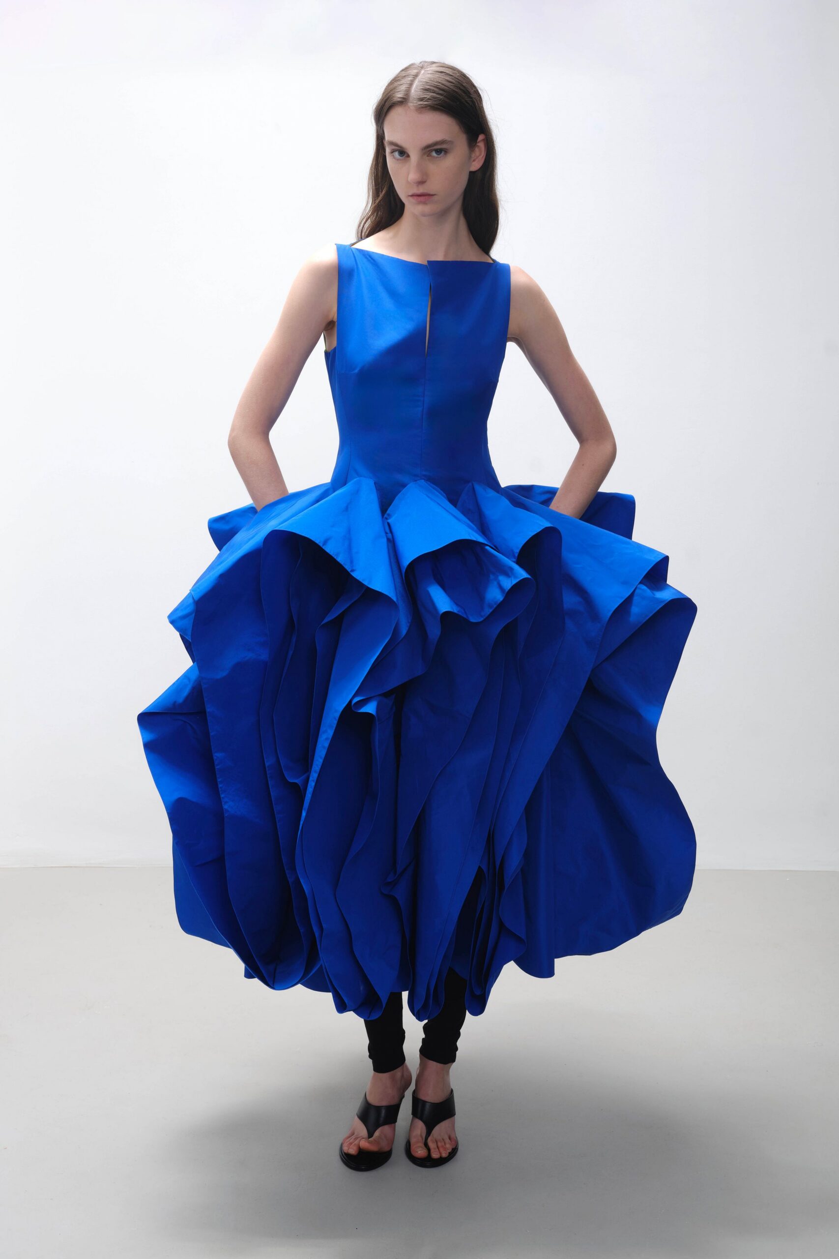 blue pleated midi dress with black shoes