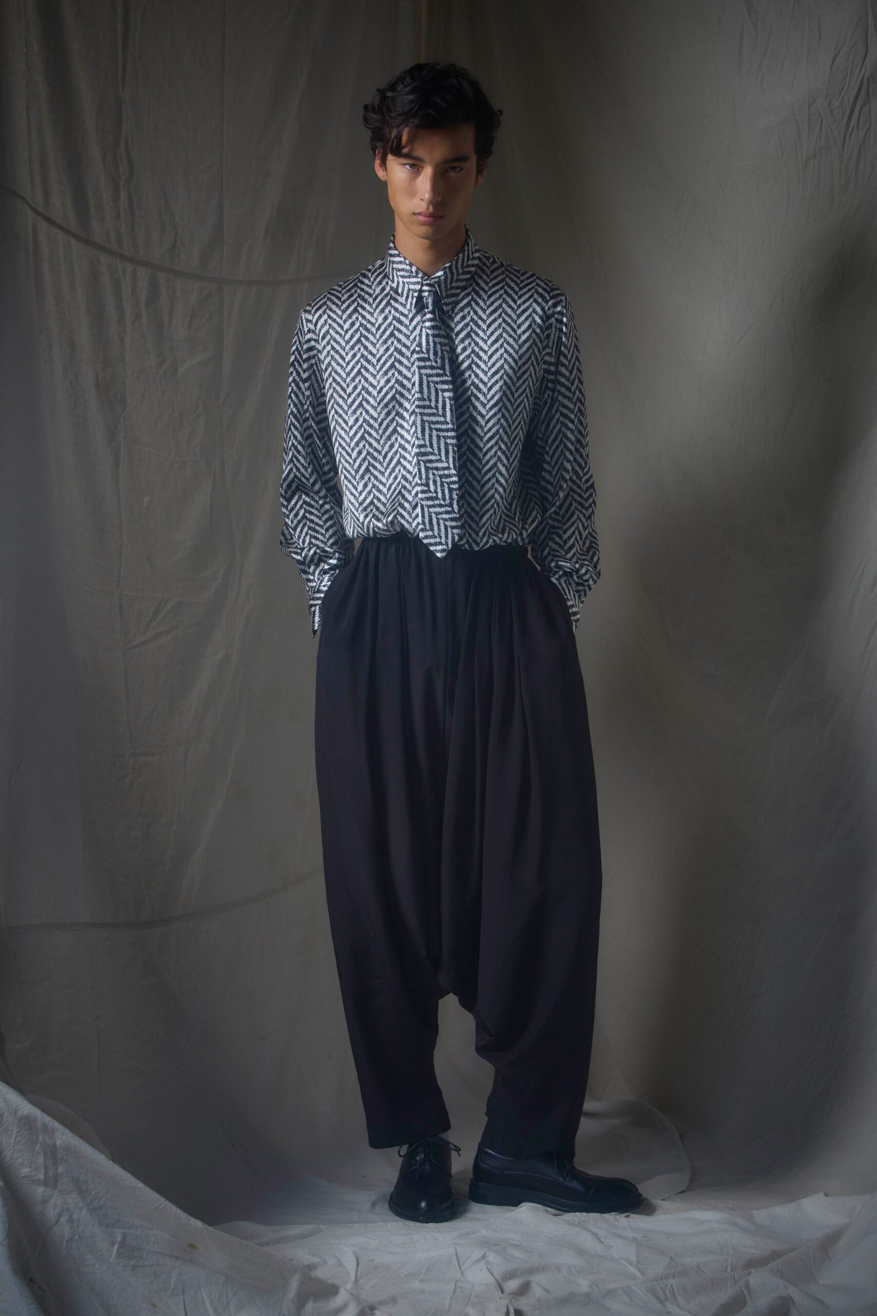 relaxed black and white shirt with pleated pants
