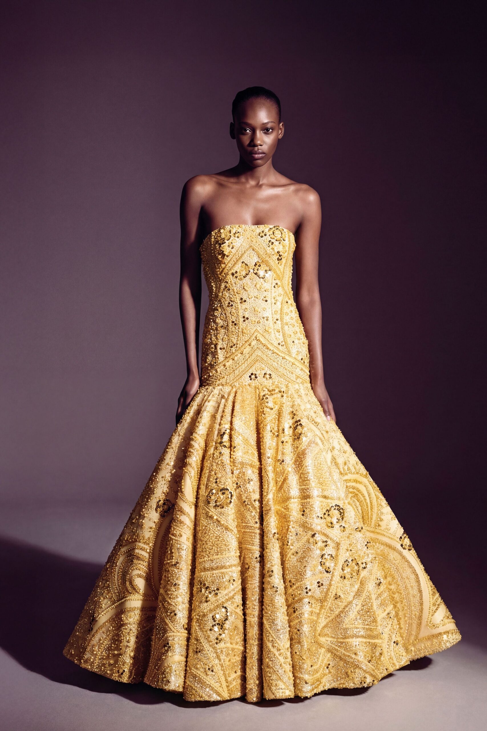 yellow beaded strapless gown
