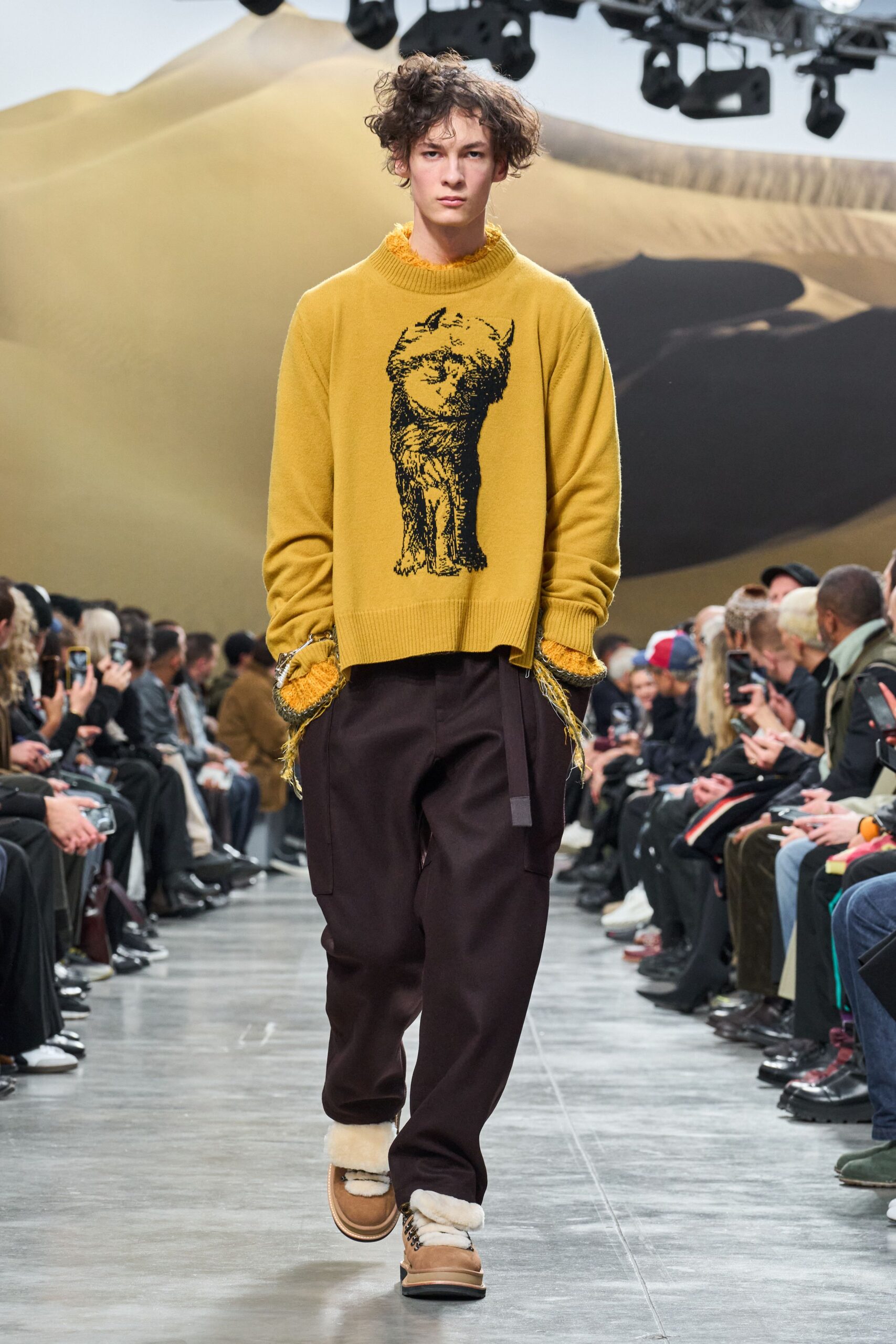 yellow embroidered sweater with brown pants