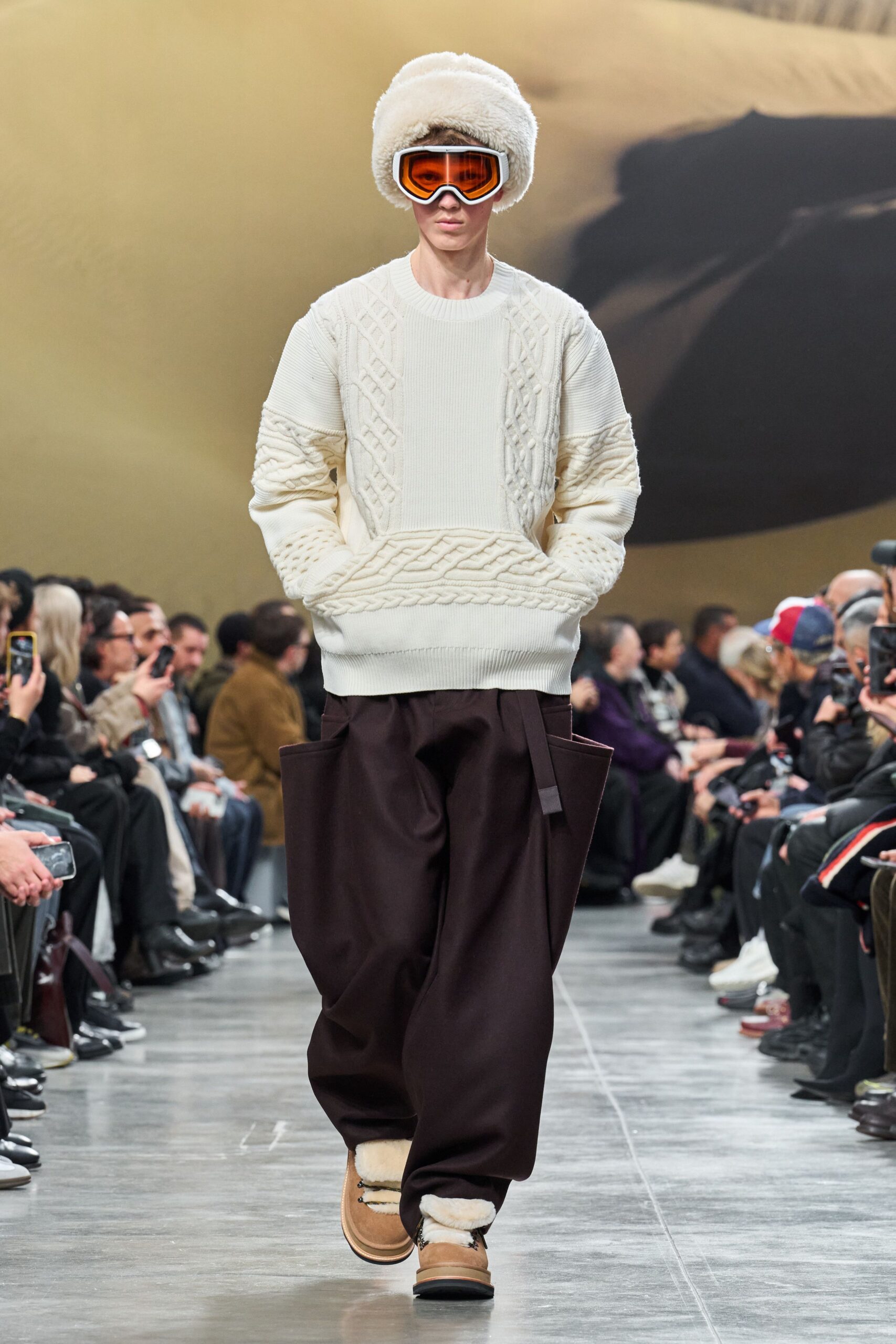 white knitted sweater with brown pants