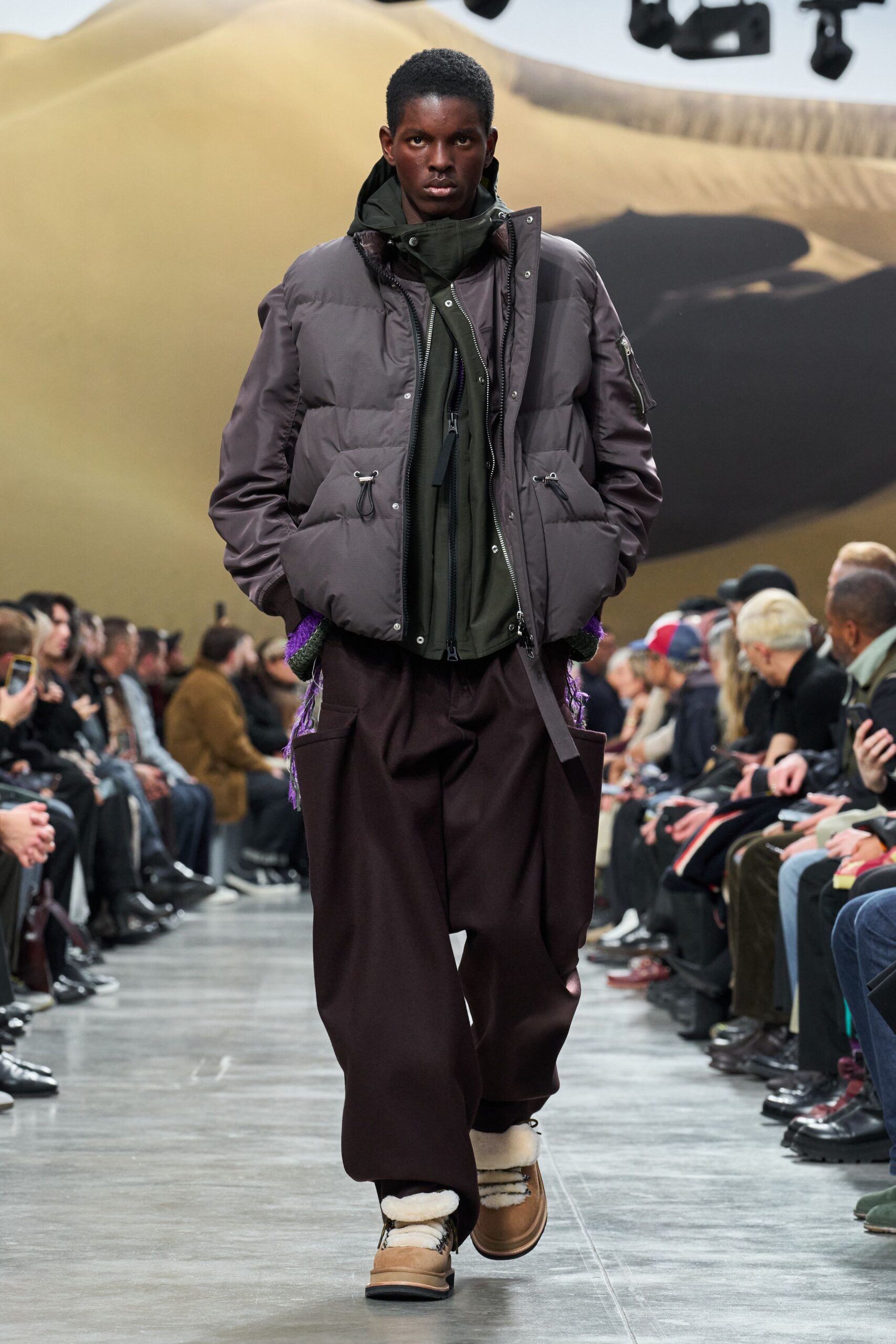 gray jacket green hoodie brown pants