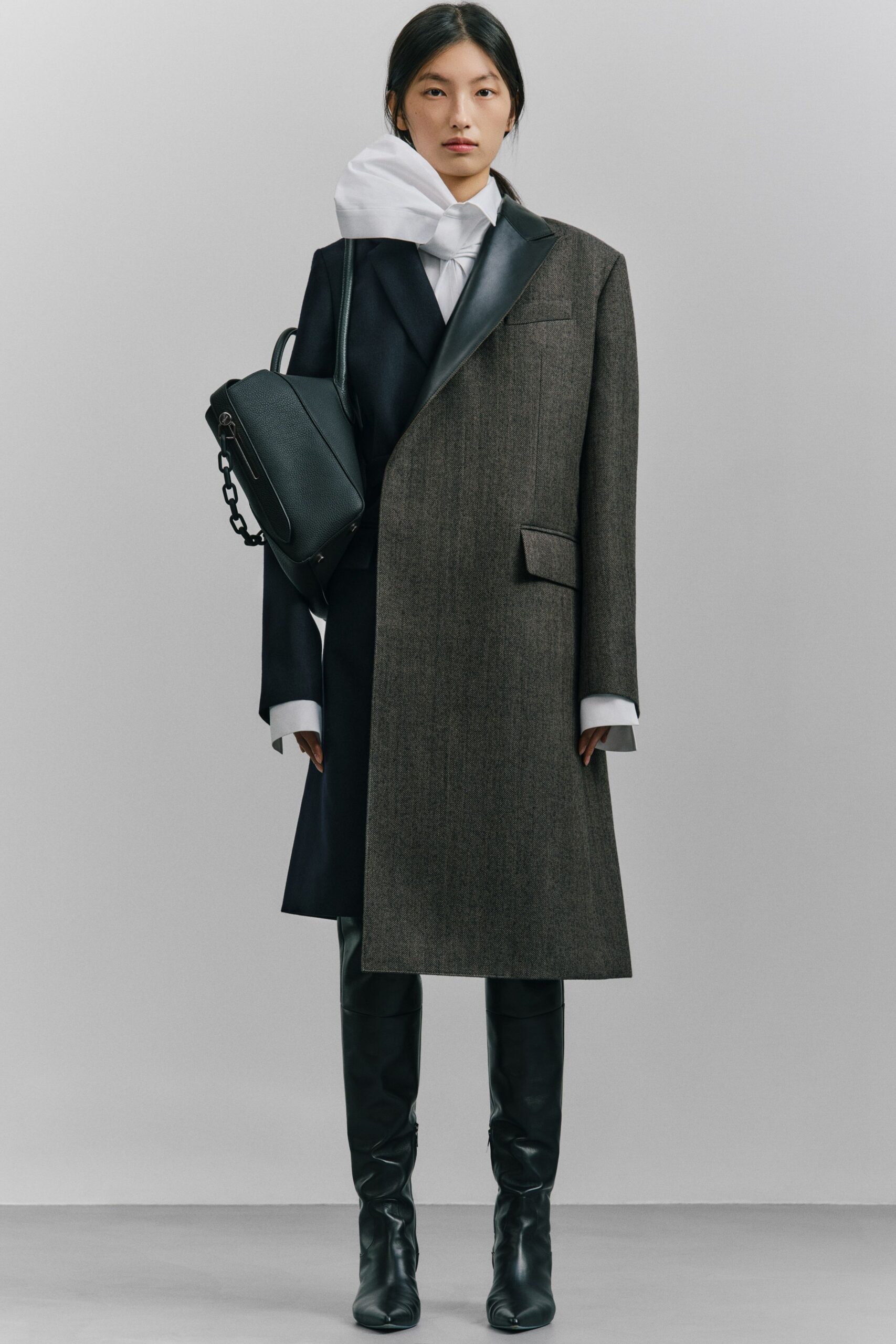 black wool long-sleeve collared structured buttoned coat