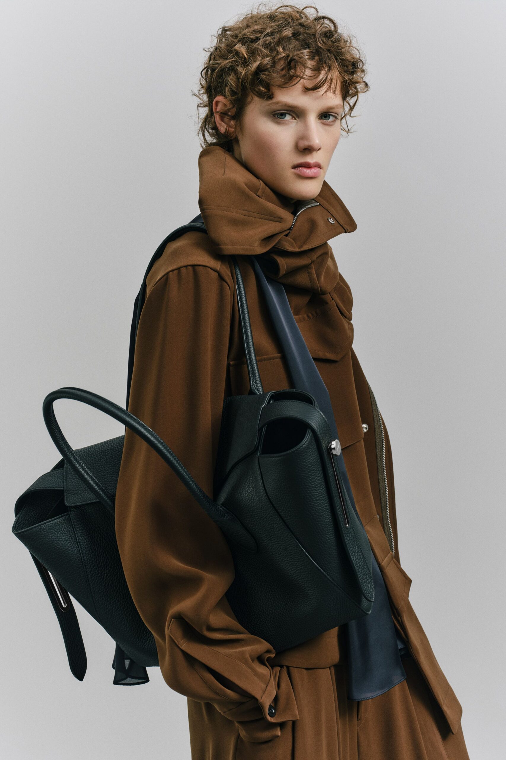 brown relaxed jacket and black top