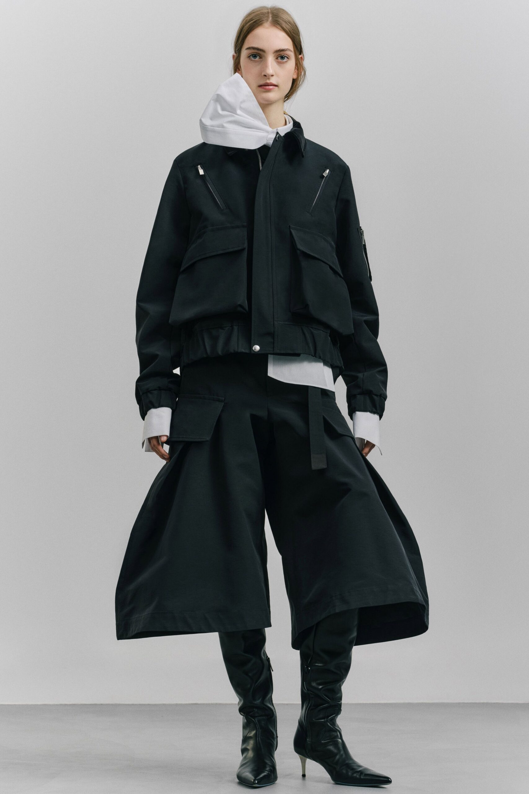 black jacket white hoodie wide-leg pants