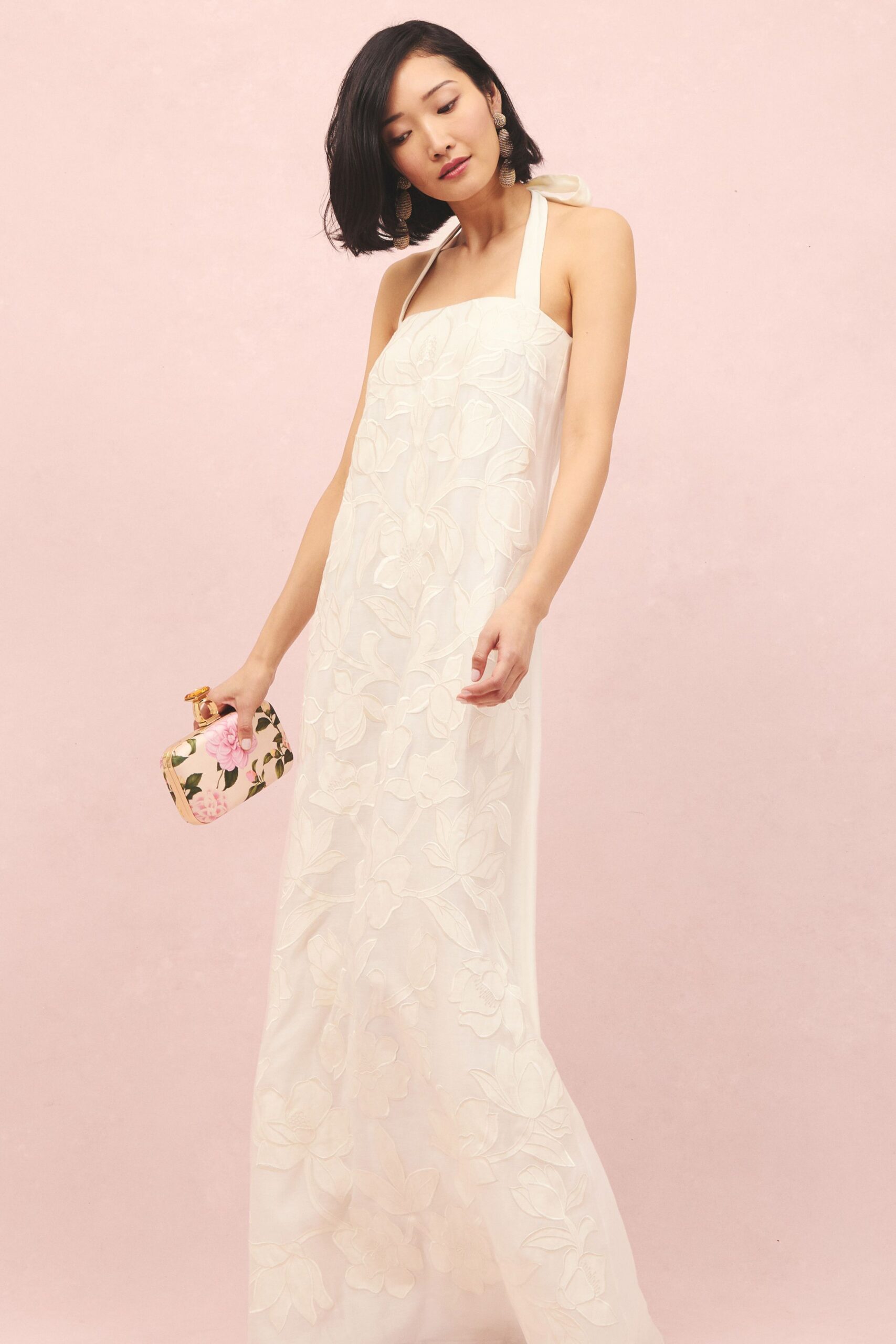 white silk sleeveless halter fitted embroidered flowing gown