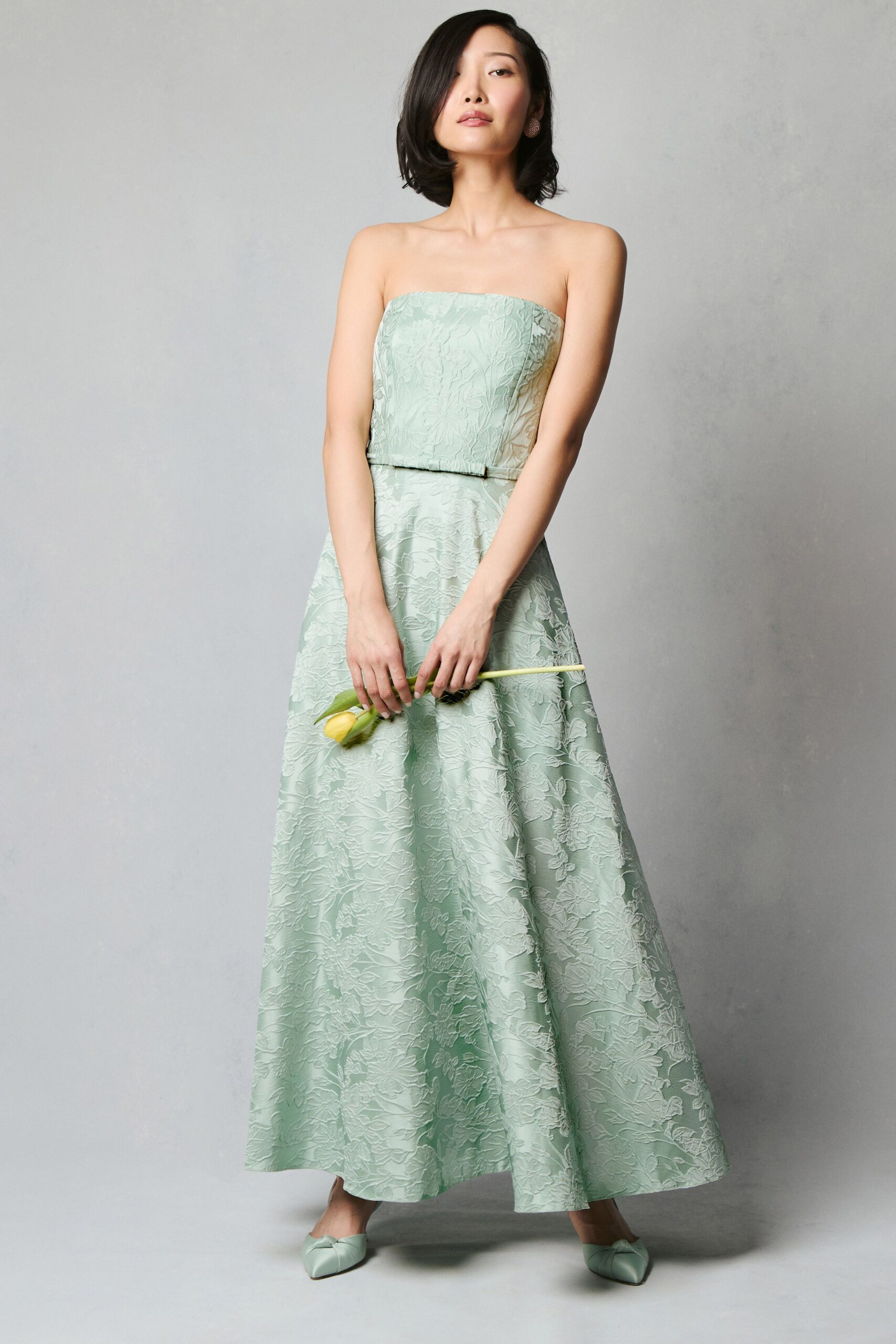 green silk strapless fitted embroidered a-line maxi gown