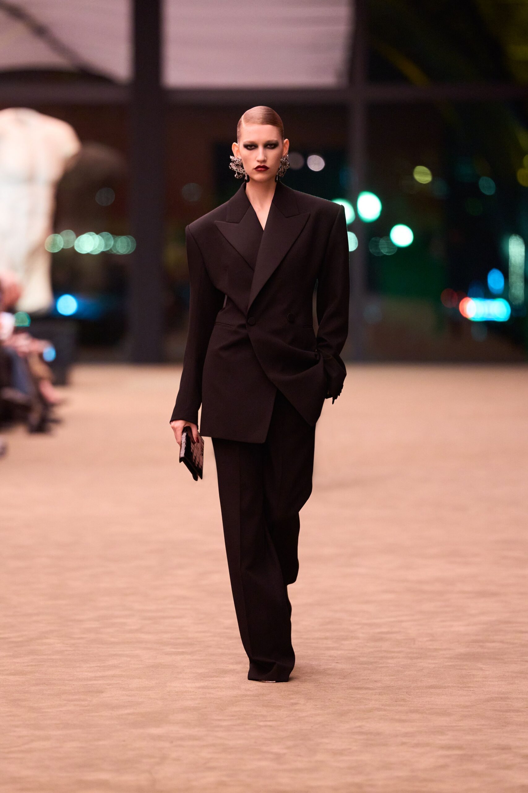 black tailored suit with clutch