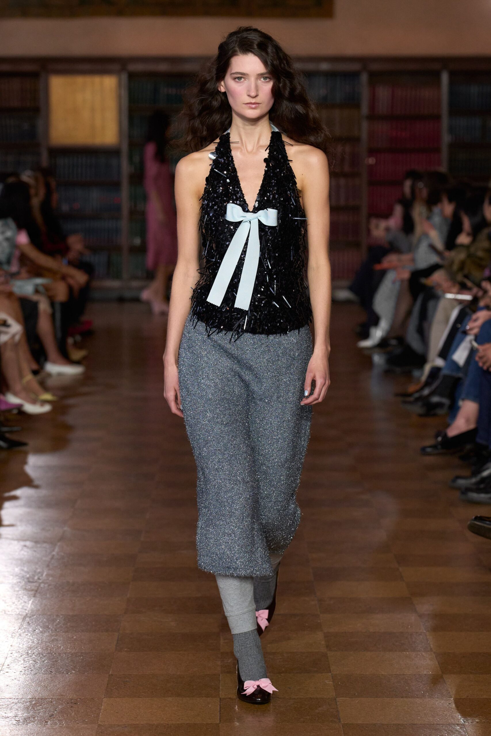 black fringed top with gray pants