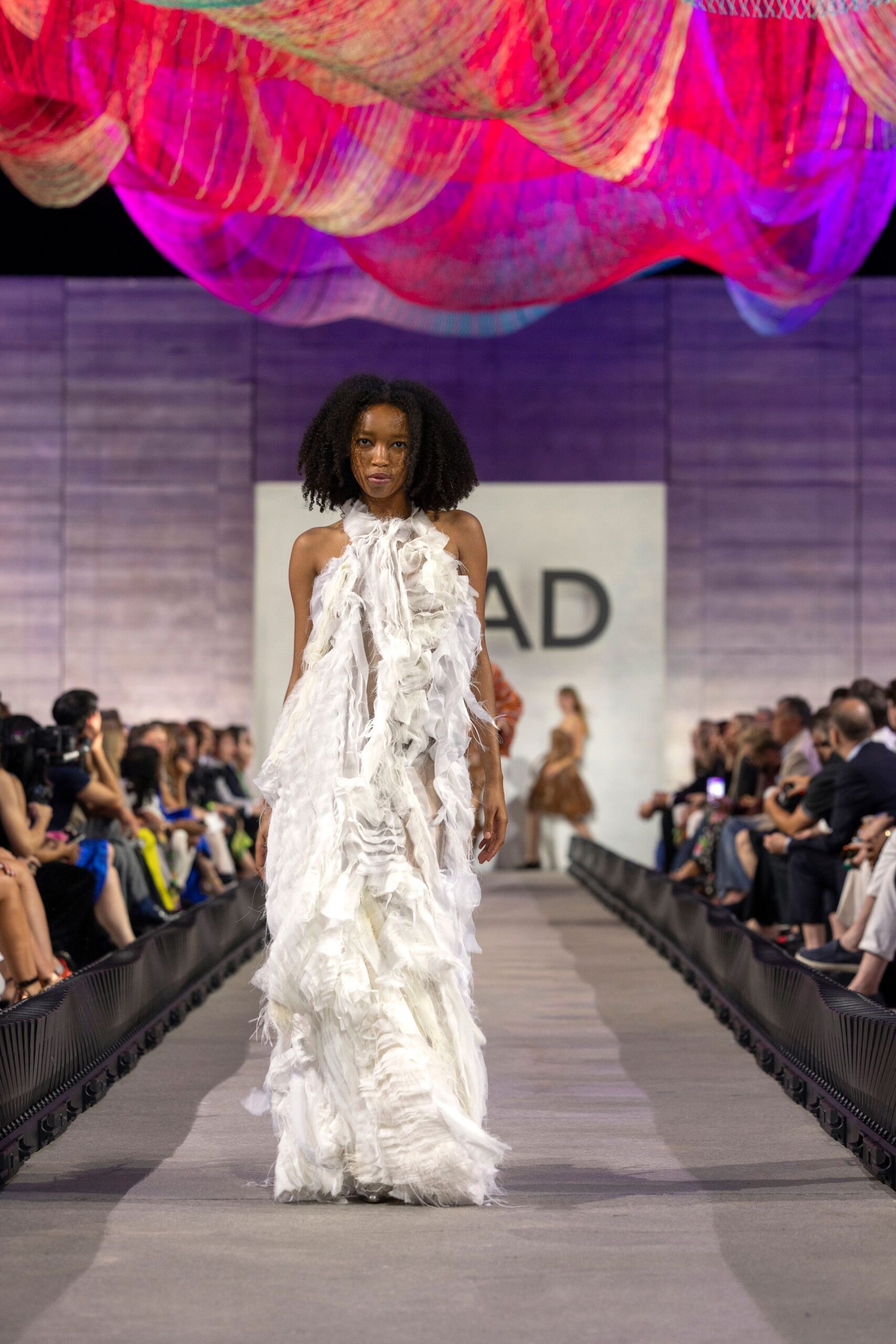 white ruffled flowing gown